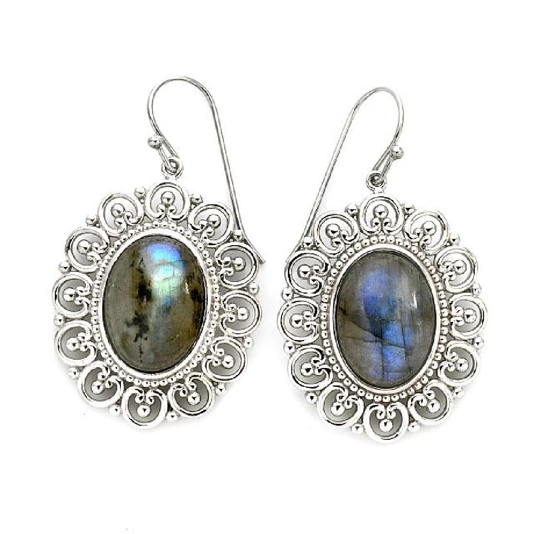 Sterling Silver Oval Labradorite Drop Earrings: • Genuine labradorite • Labradorite cabochons surrounded by beaded accent row and floral inspired cut-out designs • Comfortable french hooks • Gleaming rhodium over fine sterli
