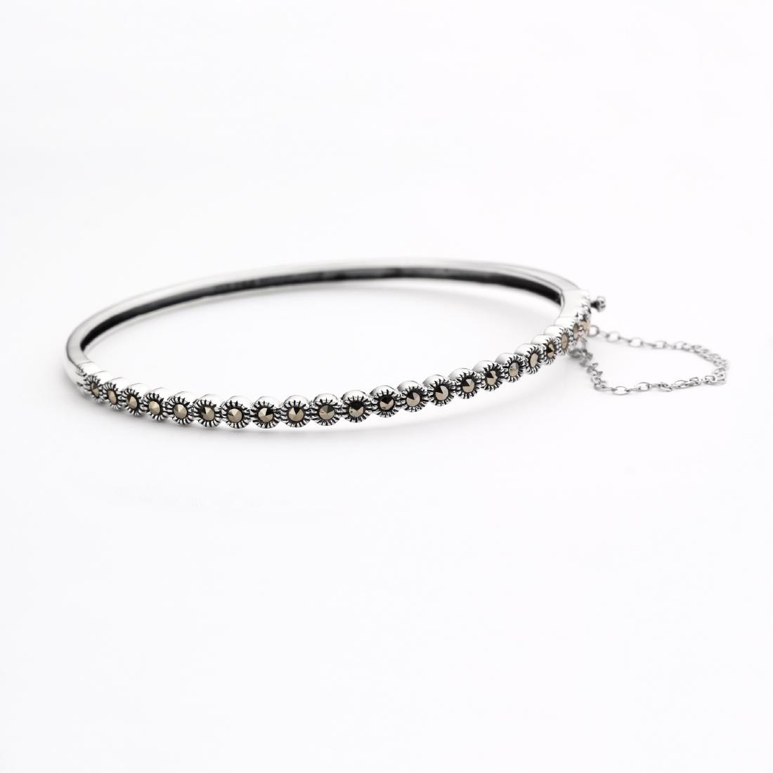 Sterling Silver Marcasite Bangle: Addison Lane crafts a lovely bangle from the Weekend Collection. Gleaming sterling silver is adorned with genuine marcasite and styled with a convenient slide insert clasp. The lovely slender design d