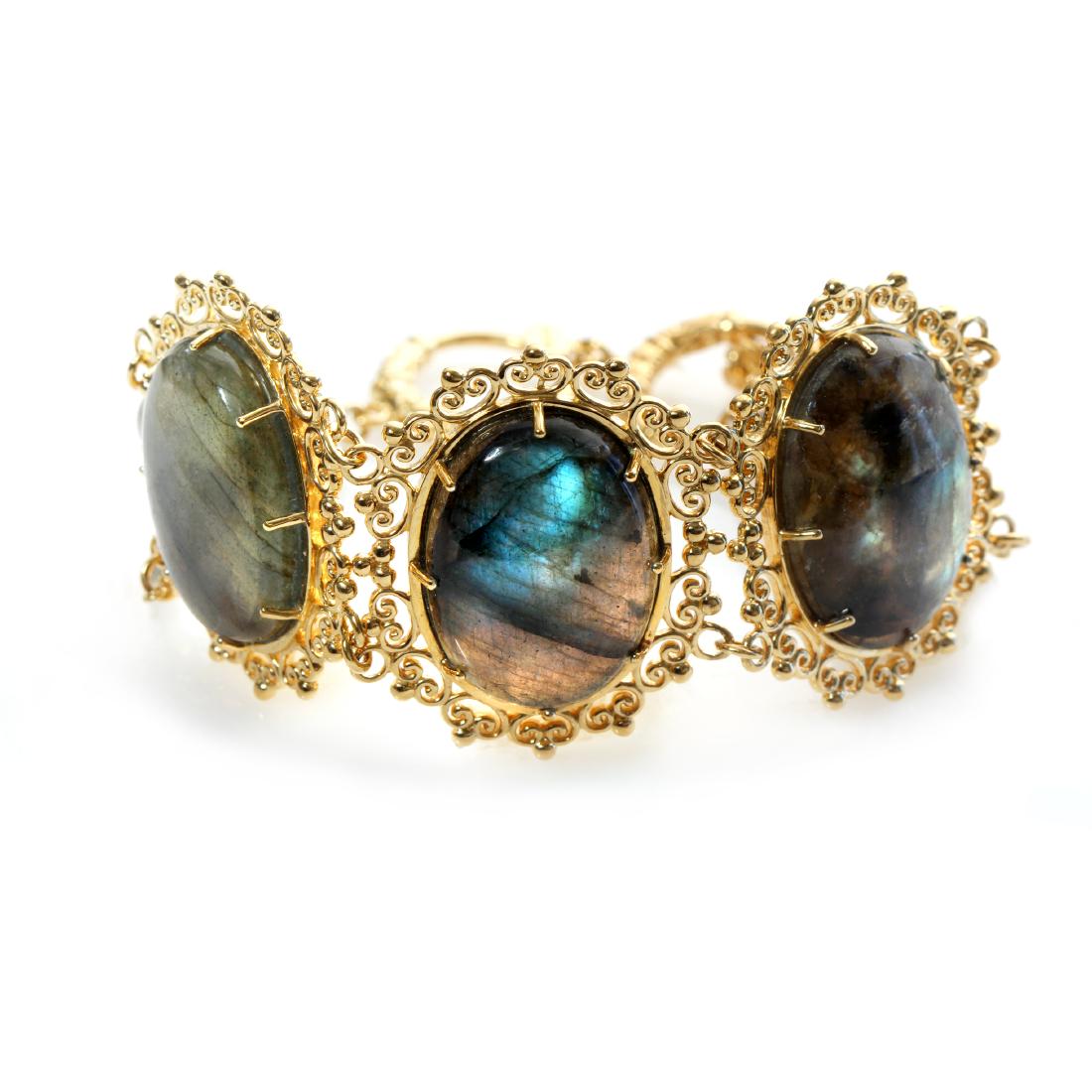 14K Gold Vemeil Labradorite Toggle Bracelet: • Genuine labradorite • Regal & elegant bracelet with three large stations at the center with an oval labradorites • 8” inch adjustable length with toggle clasp • 18k gol