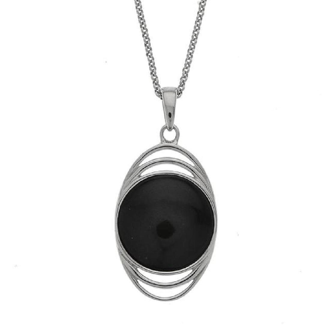 Silver Turquoise & Black Moon Reversible Pendant: • Genuine colorado black moon & campo frio turquoise • Reversible design with each gemstones cabochons on each side • 18” silver chain • Gleaming rhodium over fine sterli