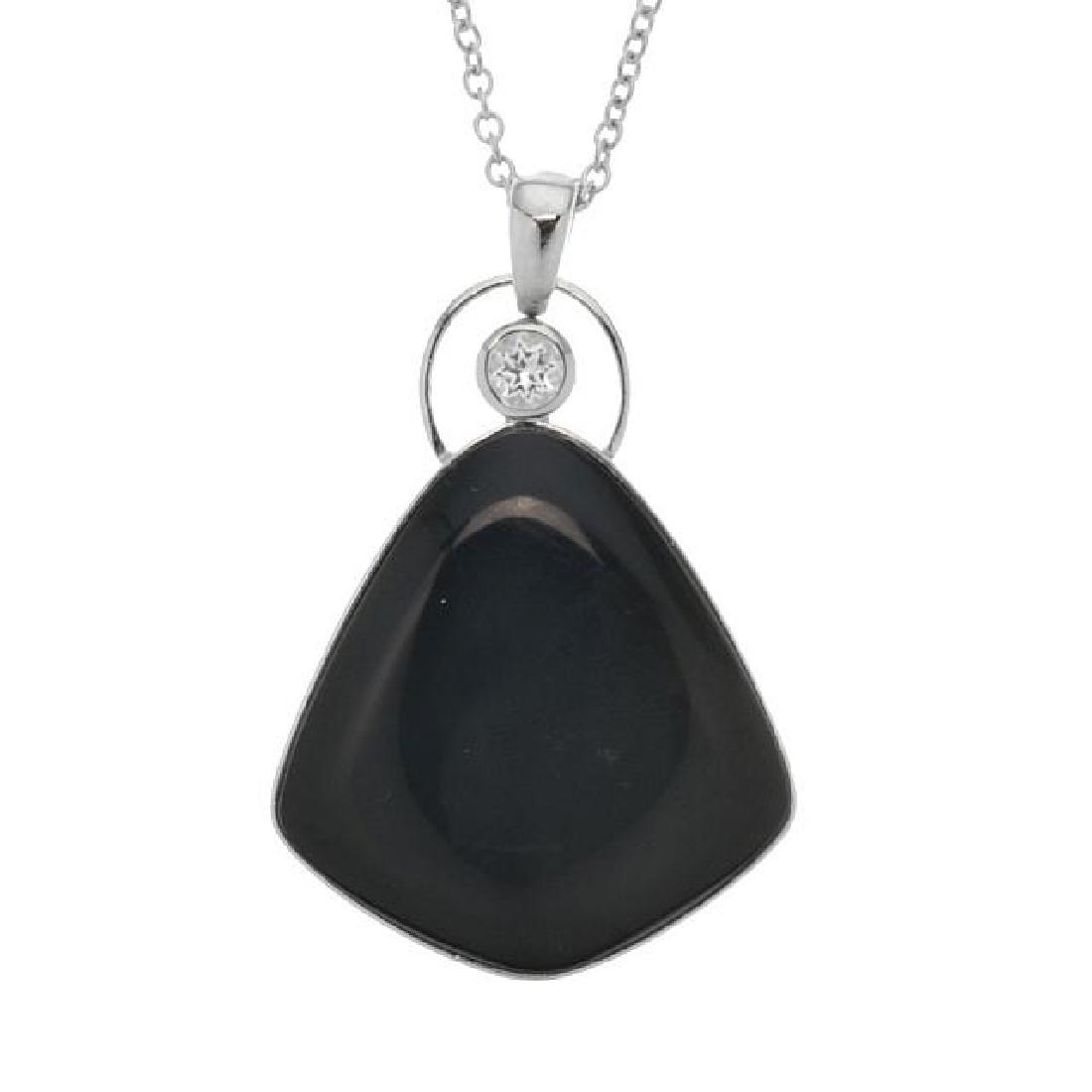 Sterling Silver Obsidian & White Topaz Pendant: Pangea Mines juxtaposes gorgeous black obsidian and white topaz in a beautifully crafted pendant necklace. Styled in rhodium over sterling silver, this impressive design includes a complementary 18