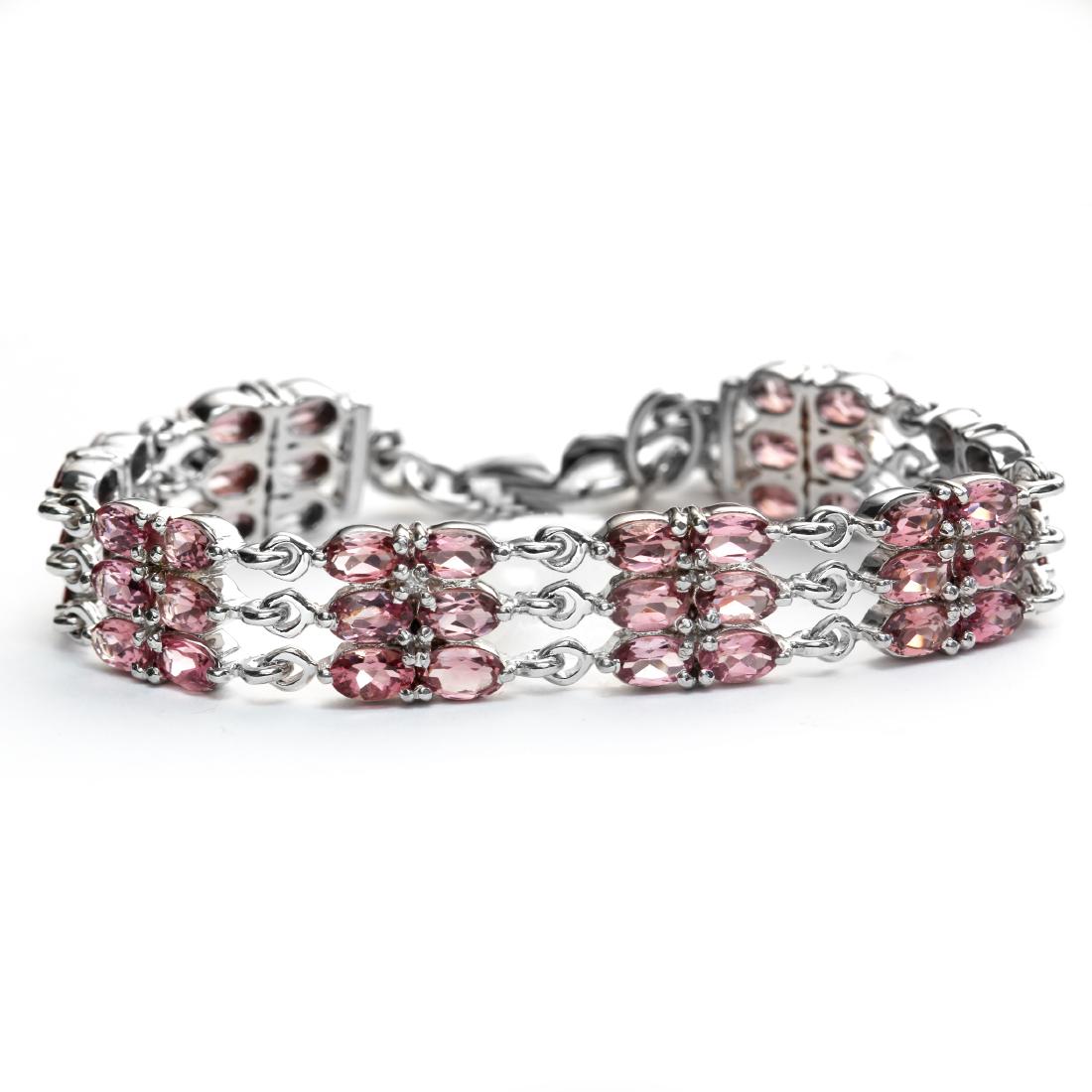 Sterling Silver 7.5" Pink Toumaline Line Bracelet: • Genuine pink tourmaline • Approximately 10.00ct pink tourmaline • 7.5 inch adjustable length • Lobster clasp • Gleaming rhodium over fine sterling silver