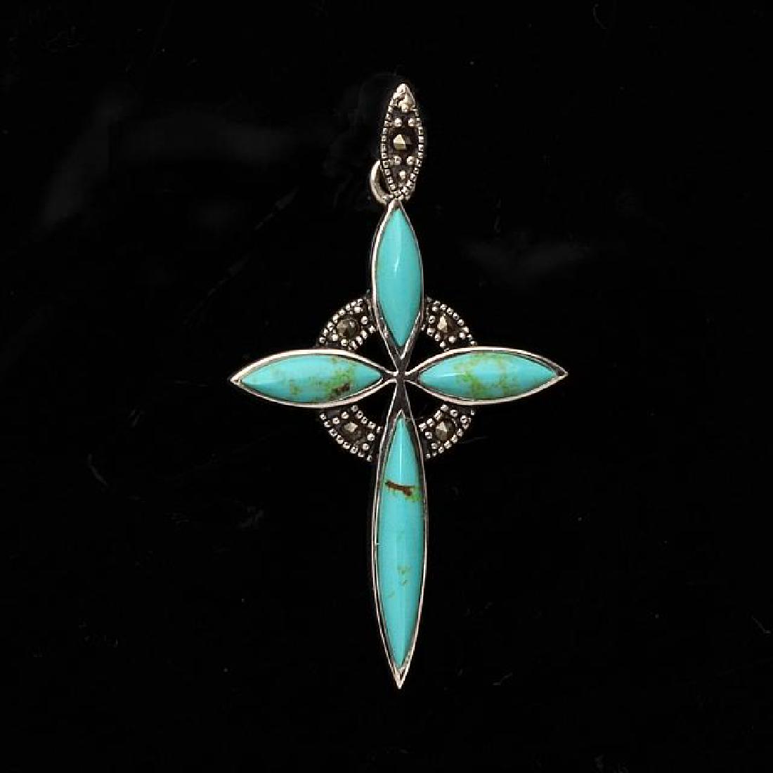 Silver Turquoise & Marcasite Cross Pendant: • Genuine turquoise & marcasite • Cross design • 18 inch silver chain • Gleaming rhodium over fine sterling silver