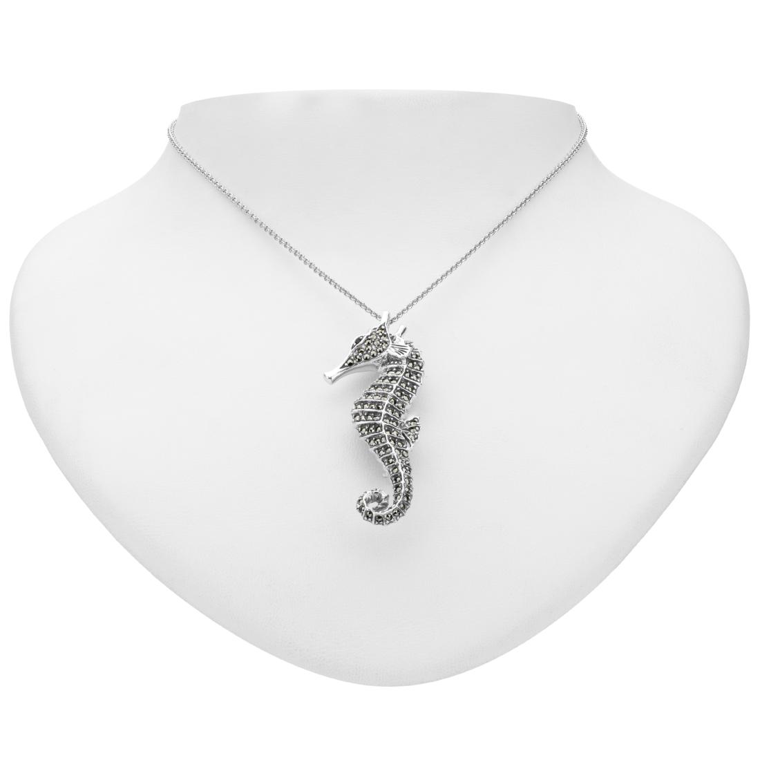 Silver Marcasite & Garnet Seahorse Pin/Pendant: Wear it as a pin or a lovely pendant necklaceâ€”this delightful design from Addison Laneâ€™s Animal Kingdom collection does double duty. Long a symbol of patience and contentment, this charm