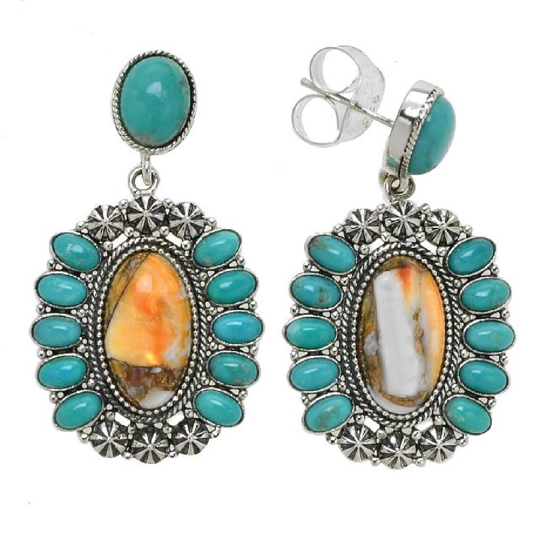 Silver Spiny Oyster & Turquoise Drop Earrings: • Genuine spiny oyster & campo frio turquoise • A large oval cabochons surrounded by small cabochons on the sides • Oxidized trio starburst decorates the north and the south • 