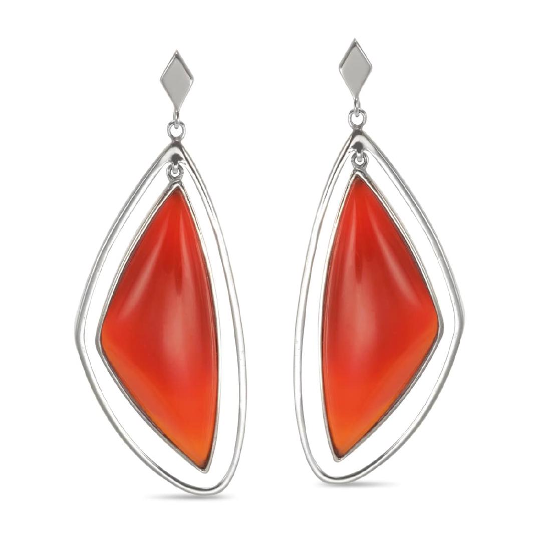 Sterling Silver Organic Carnelian Drop Earrings: Expertly executed in polished rhodium over 925 Sterling Silver, each earring in this charming pair features a slightly freeform, triangular shaped outer wire-style frame with one dyed red carnelian of
