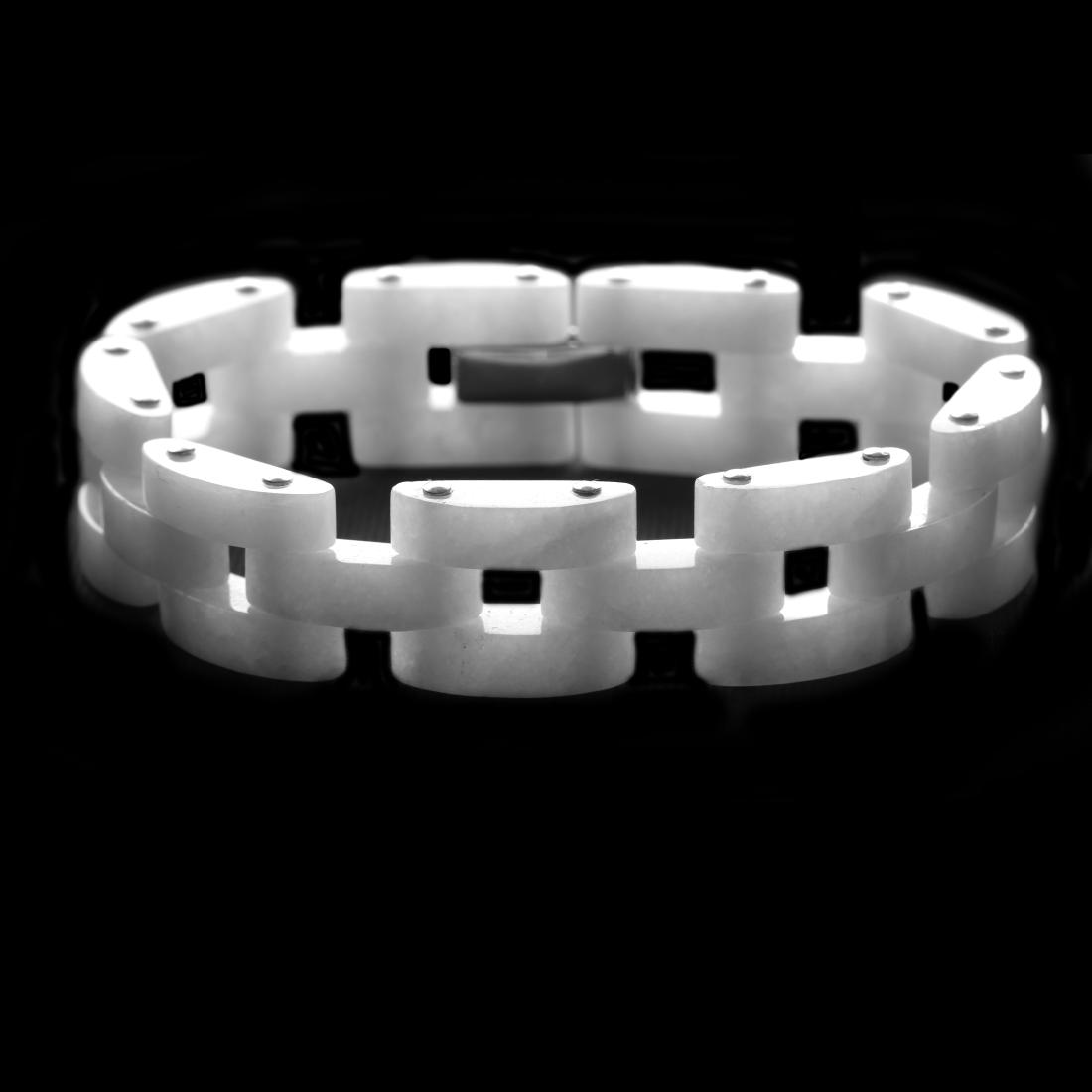 Sterling Silver 7.5" White Jade Link Bracelet: A striking contemporary design from the Pangea Mines Jade Royale collection—a smart link-style bracelet beautifully crafted in fine sterling silver and adorned with genuine white jade. Add a bri