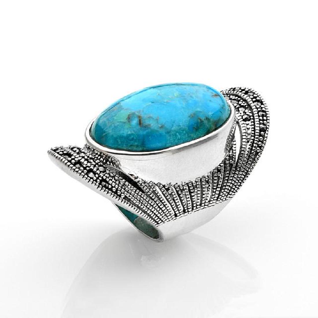Sterling Silver Turquoise & Marcasite Ring-SZ 7: • Genuine turquoise & marcasite • One oval cabcohon 26x16.5mm • Textured miligrain backdrop encrusted with marcasite • Gleaming rhodium over fine sterling silver