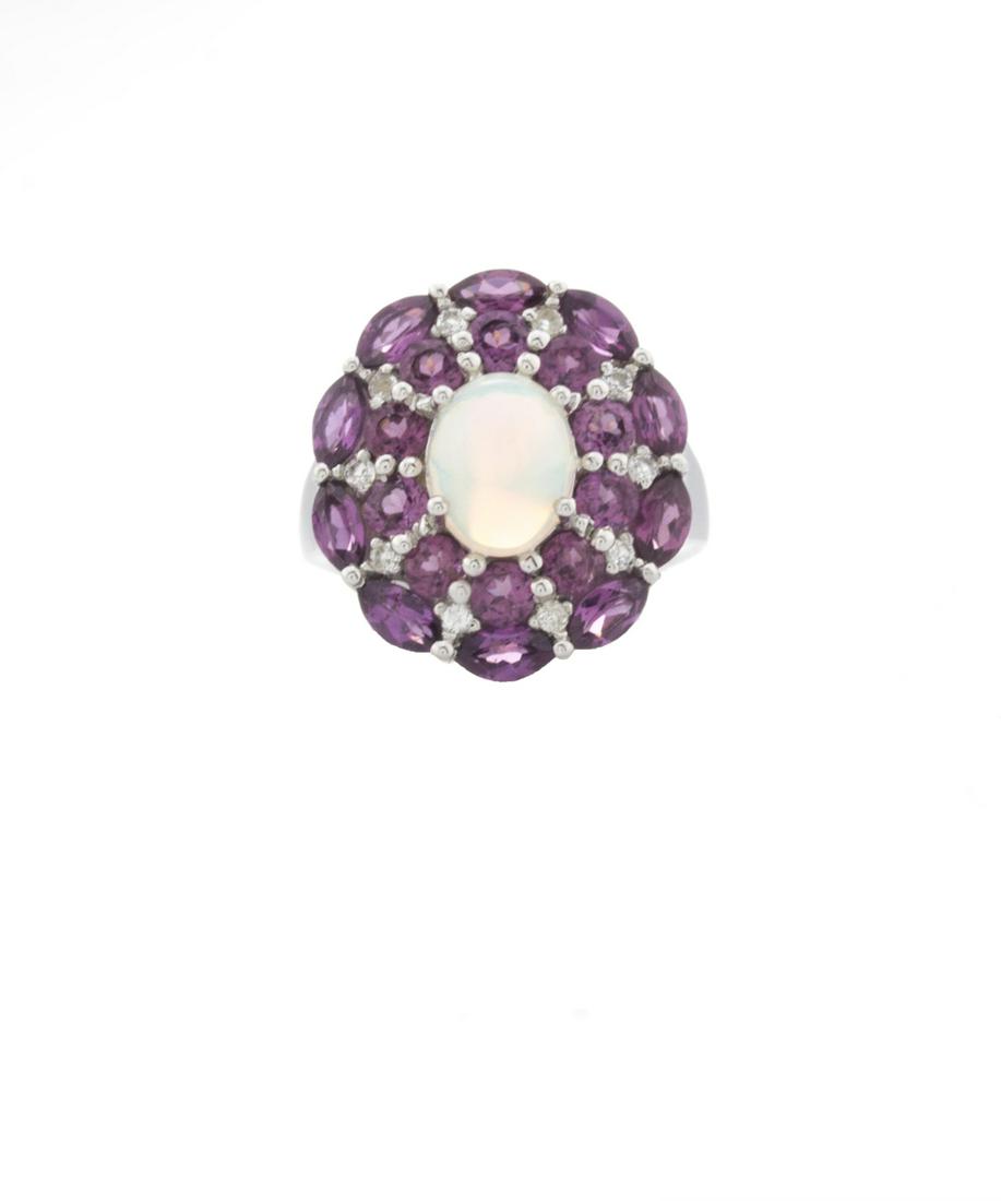 Silver Ethiopian Opal & Garnet Halo Ring-SZ 8: Make a statement and make it beautifully with this striking design from the Pangea Mines Treasured Gems Collection. Beautifully crafted in gleaming anti-tarnish rhodium over sterling silver and adorne