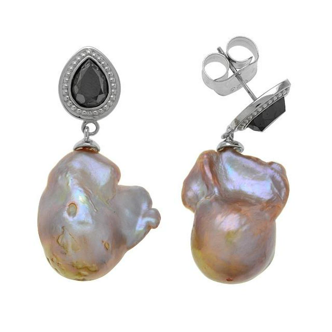 Silver Baroque Pearl & Hematite Drop Earrings: • Genuine baroque pearl & hematite • Drop with beaded halo on the top • Comfortable butterfly clasp • Gleaming rhodium over fine sterling si