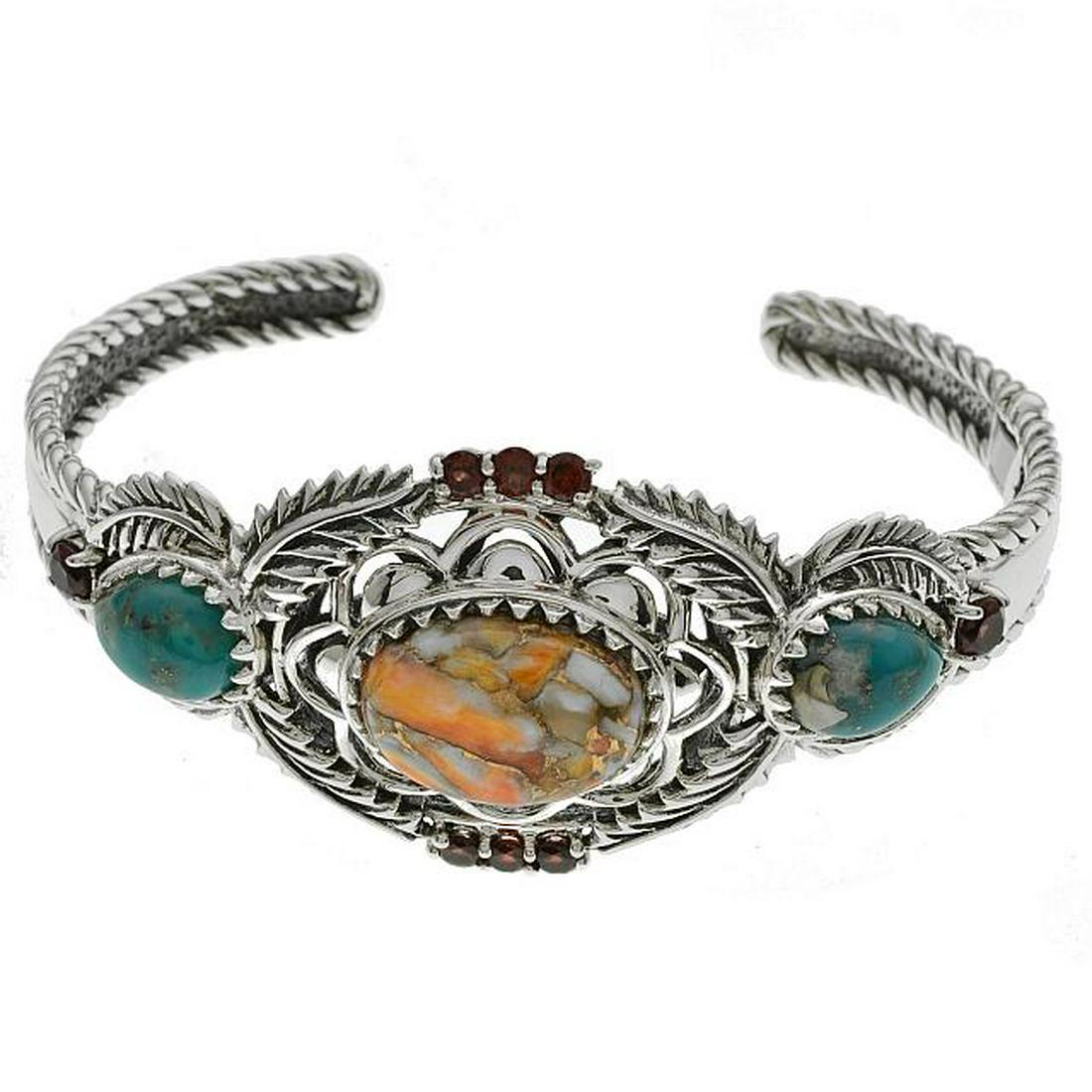 Silver 7.25" Spiny Oyster & Turquoise Hinged Cuff: • Genuine spiny oyster, campo frio turquoise & mozambique garnet • 1.34cwt mozambique garnet • Oxidized feather & arch shape cutouts hinged cuff • 7.25 inch wearable length 