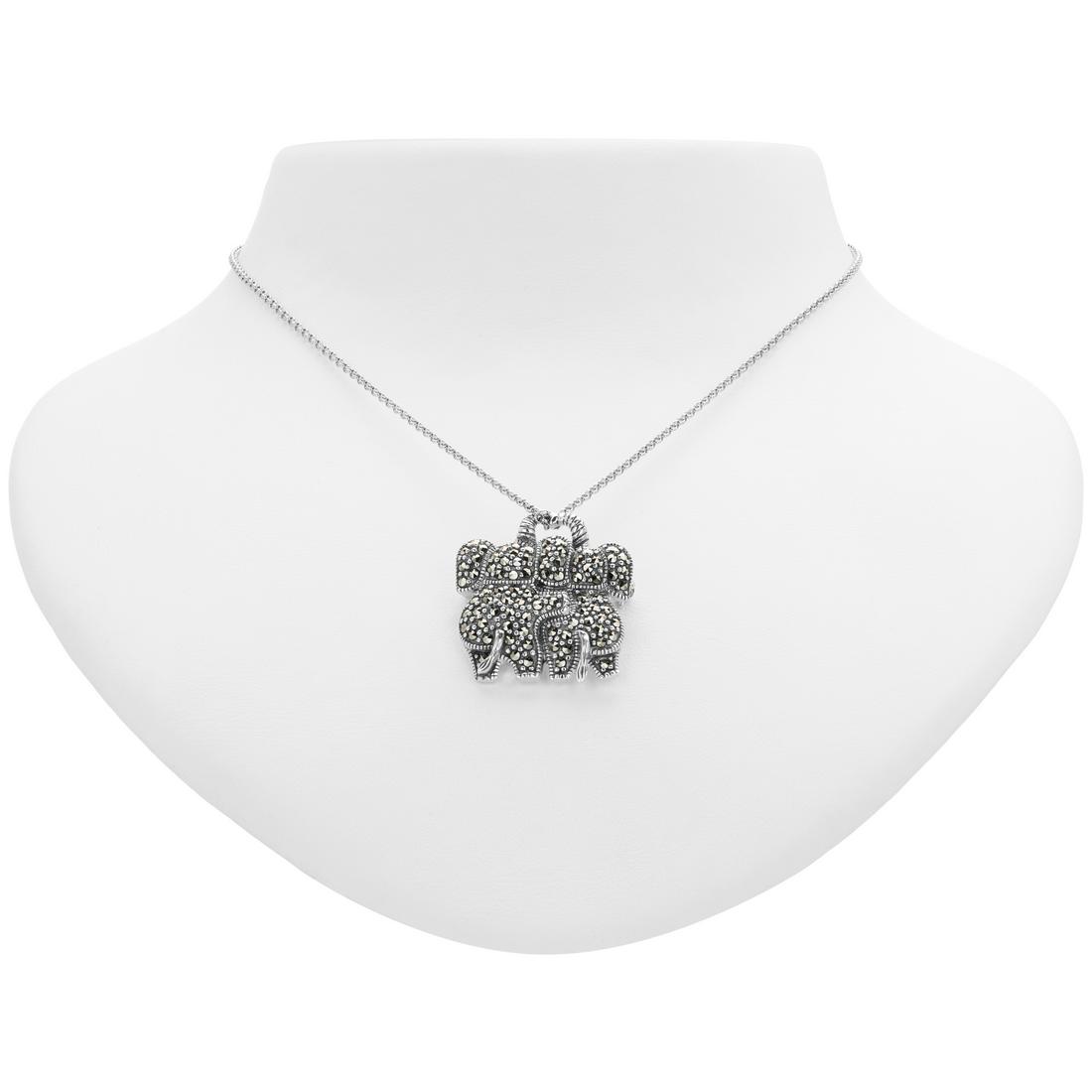 Silver Marcasite Double Elephant Pin/Pendant: Wear it as a pin or a lovely pendant necklace—this delightful design from Addison Lane’s Animal Kingdom collection does double duty. These charming elephant buddies are beautifully crafted