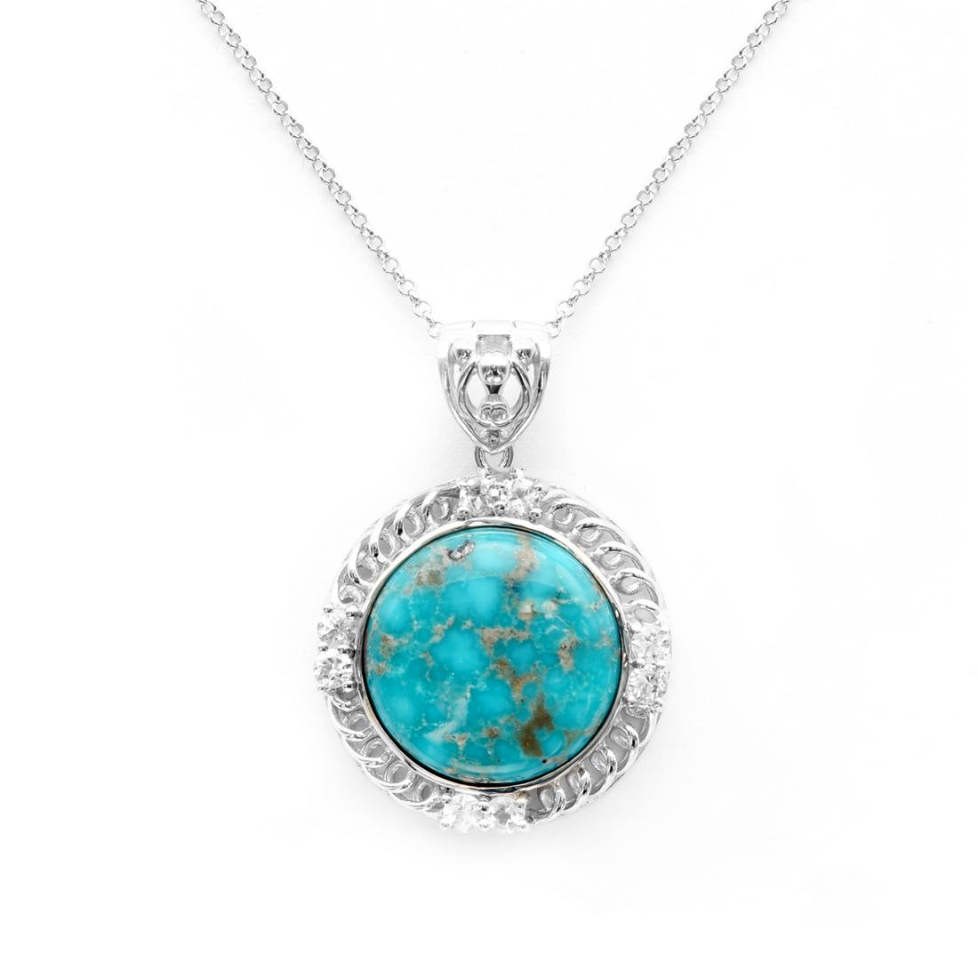 Sterling Silver Campo Frio & Topaz Pendant: Genuine Turquoise is surrounded by a border of sparkling white topaz on a beautifully crafted rhodium, over sterling silver setting to create an eye-catching design. A complementary 18” rolo cha