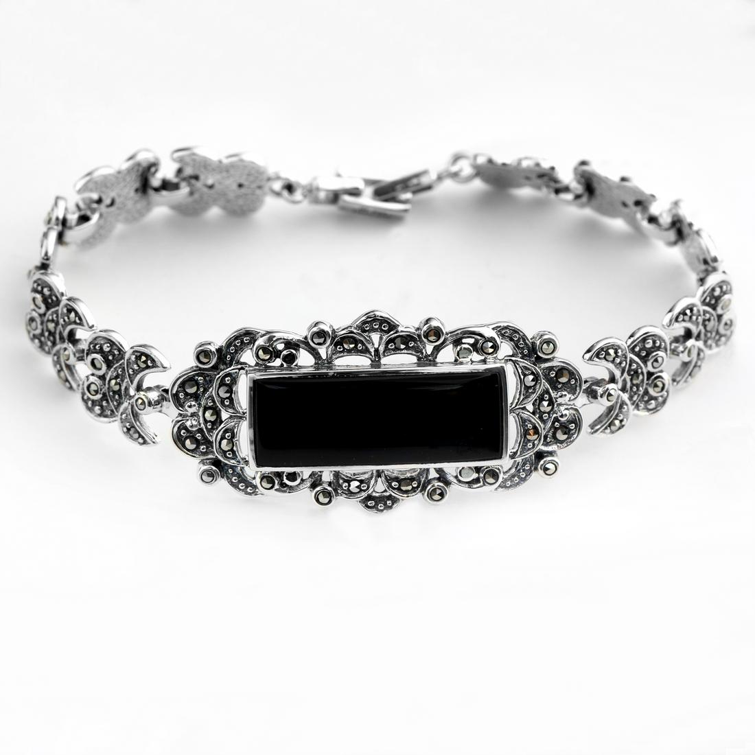 Silver Black Onyx & Marcasite Bar Bracelet 7.2": • Genuine black onyx & marcasite • Slide insert clasp for secure fit • 7.2 inch length • Gleamingrhodium over Fine sterling silver