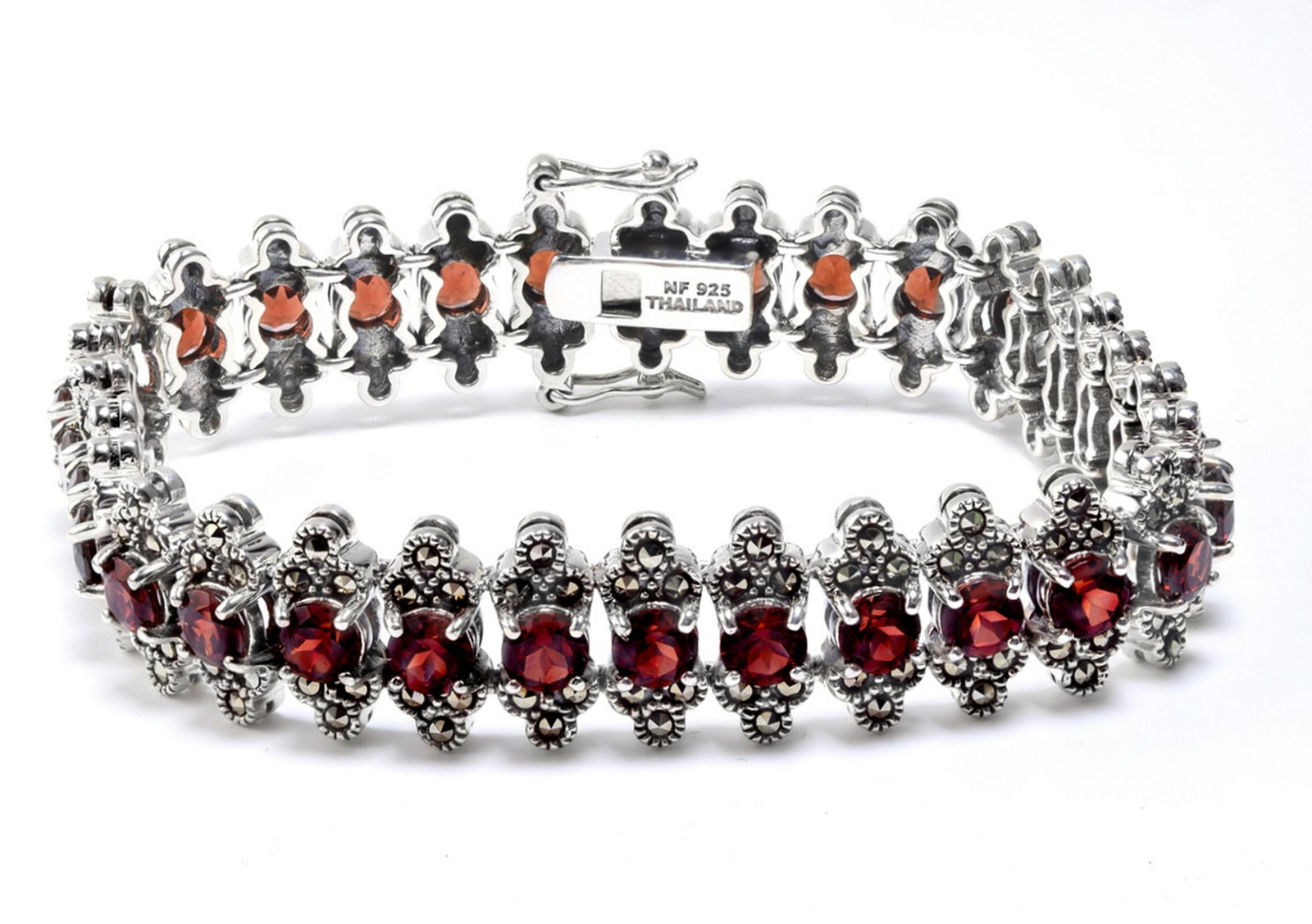 Silver Garnet & Marcasite Line Bracelet 7.5": This lovely slender bracelet from the Pangea Mines Treasured Gems Collection is beautifully crafted in fine sterling silver and adorned with sparkling genuine Mozambique garnet accented by marcasite. 