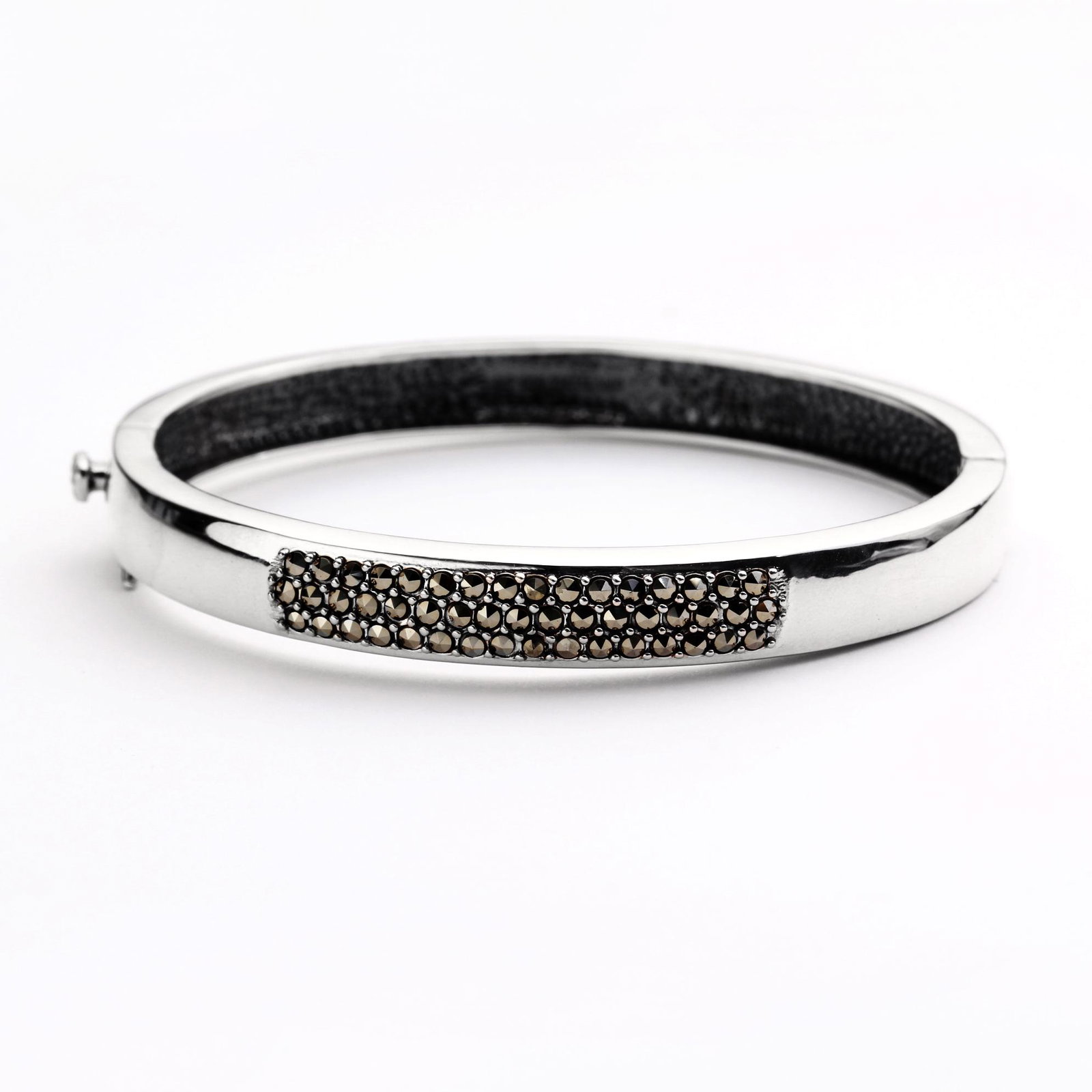 Sterling Silver Marcasite Pave Bangle 7.5": • Genuine marcasite • Stones in pave settings • Slide insert clasp for secure fit • 7.5 inch length • Gleaming rhodium over fine sterling silver