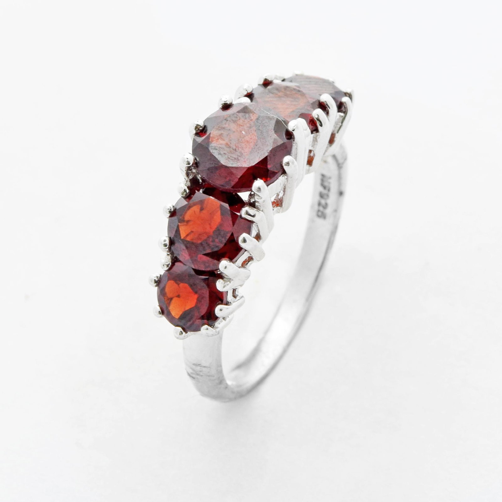 Silver 4.08ct Garnet Graduated Ring-SZ 8: • Genuine garnet • 4.08ct garnet • Five round cut gemstones graduating in size • Gleaming rhodium over fine sterling silver • Garnet is the birthstone for the month of Ja