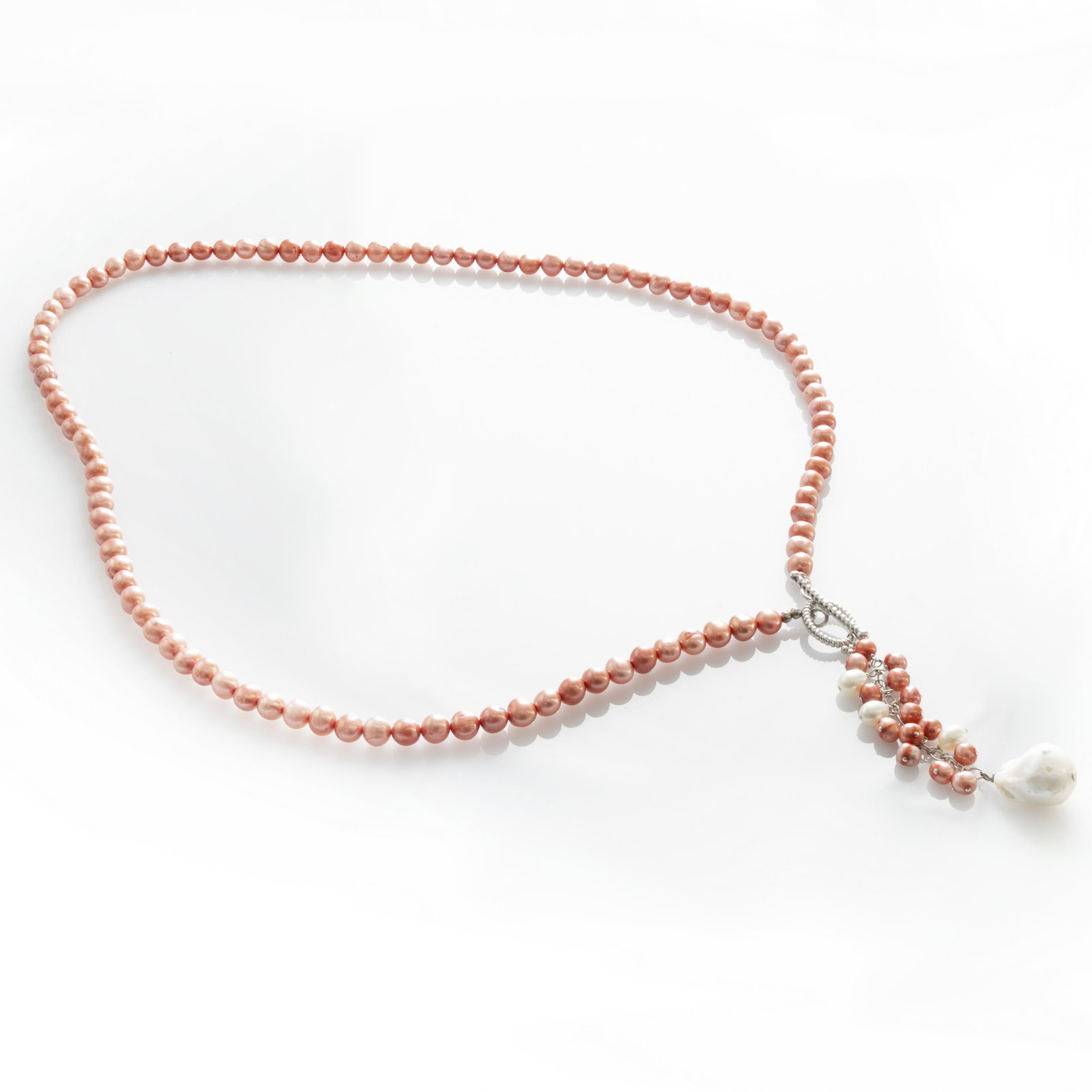 Sterling Silver Fresh Water Pearl Y Necklace: • Genuine pink & white freshwater pearls • 28 inch length Y necklace • 5-7mm sizes pearls • Fancy toggle clasp • Gleaming rhodium over fine sterling silver
