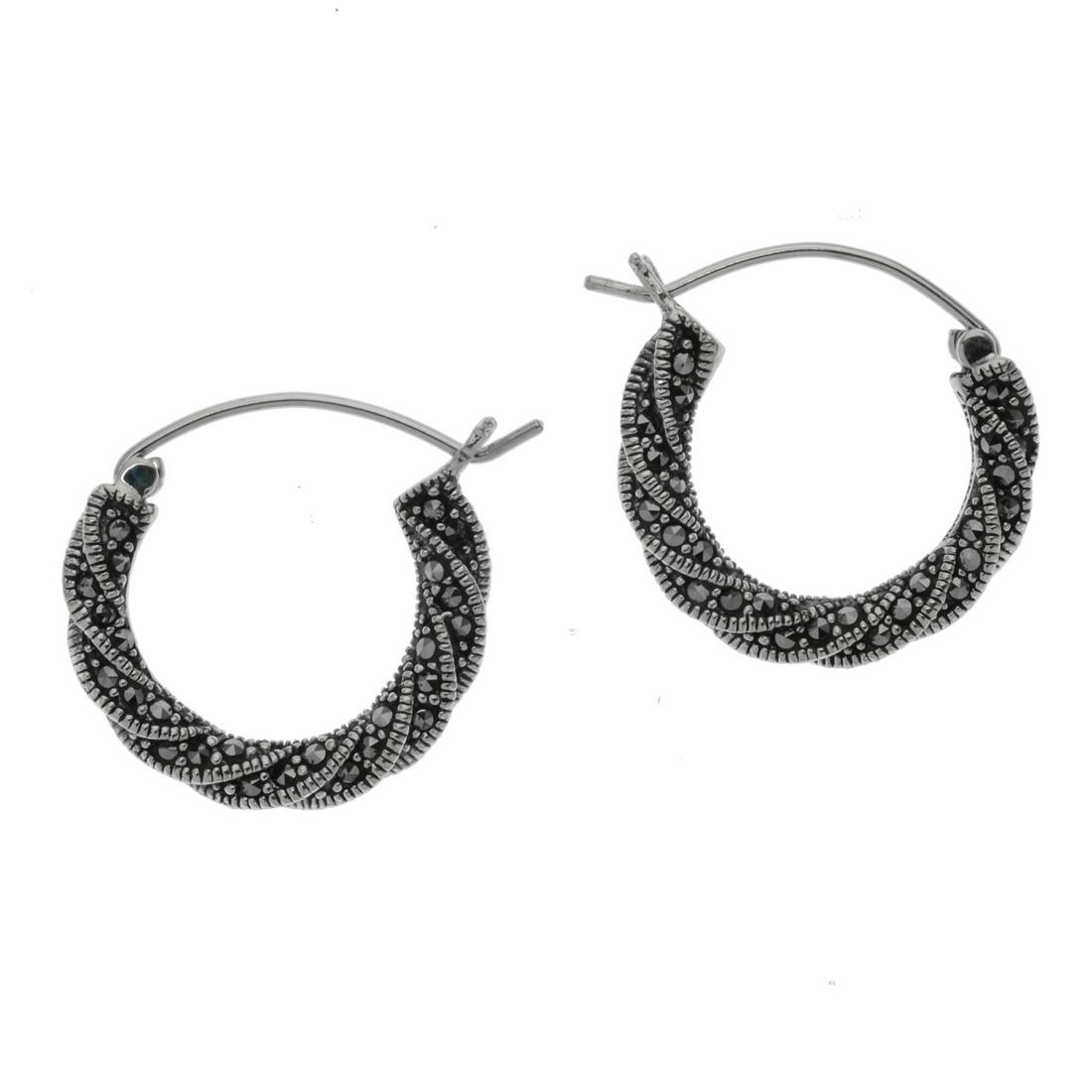 Sterling Silver Marcasite Hoop Earrings: • Genuine marcasite • Twisted hoop style • Hinged earback • Gleaming rhodium over fine sterling silver