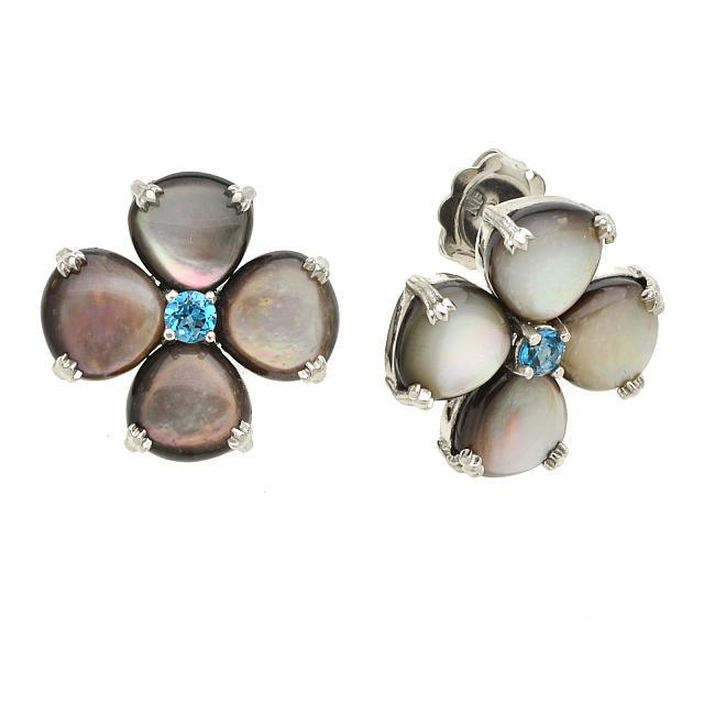 Silver Grey MOP & Blue Topaz Flower Stud Earrings: • Genuine MOP & London Blue Topaz • Petal shape stone floral studs • Secured butterfly clasp • Gleaming rhodium over fine sterling silver