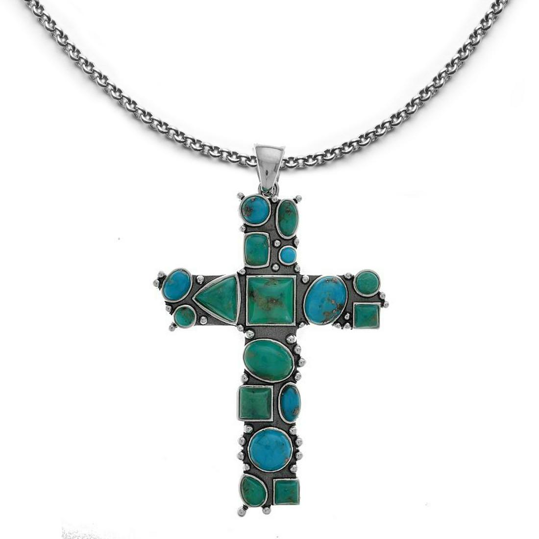 Sterling Silver Campo Frio Turquoise Cross Pendant: Heavenly Campo Frio Turquoise is beautifully paired with 925 sterling silver to create an absolutely eye-catching pedant, one that will certainly garner attention and compliments. Beautifully crafted 