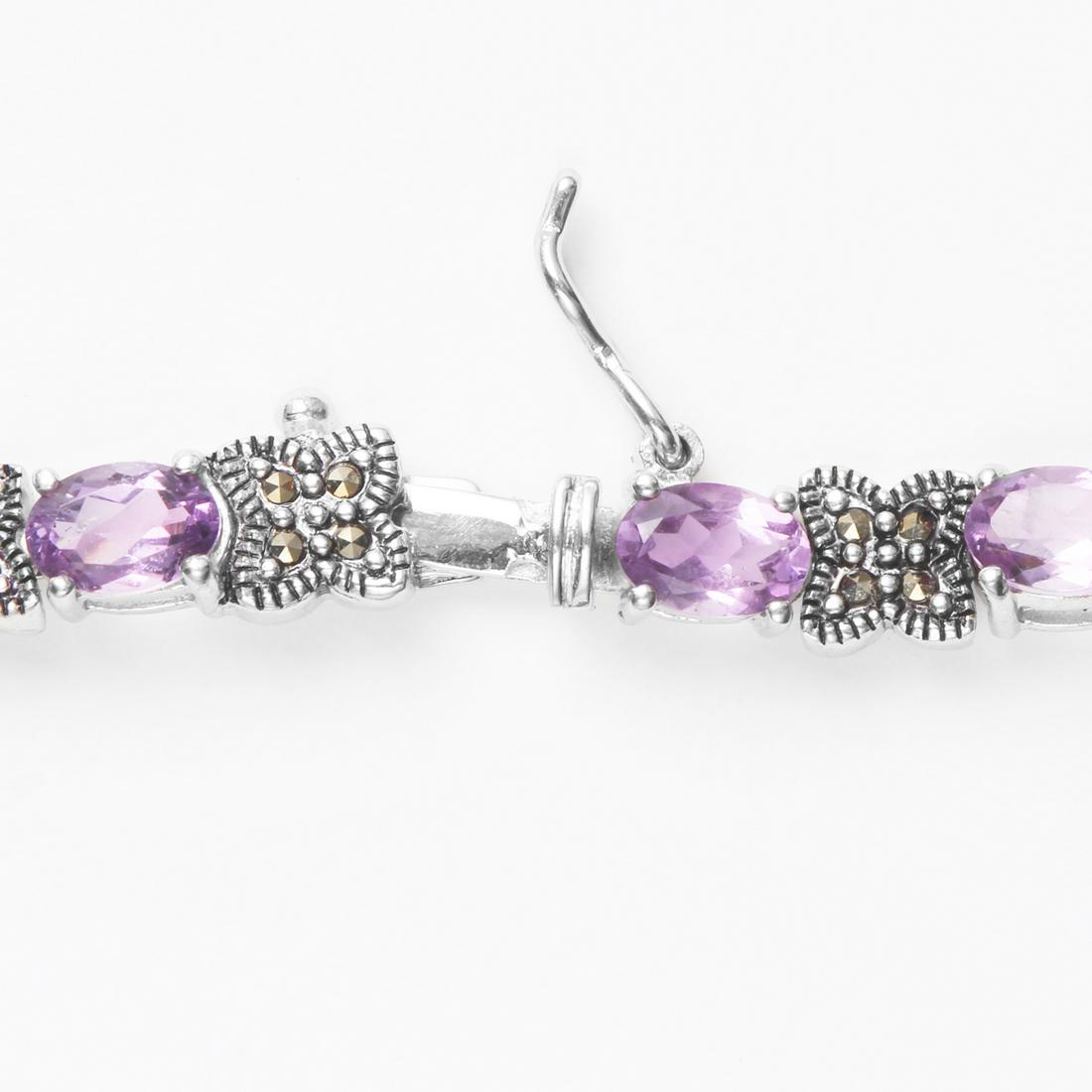 Sterling Silver Amethyst & Marcasite Line Bracelet: • Genuine amethyst & marcasite • Alternate gemstones • Slide insert clasp for secure fit • 7.5 inch length • Gleaming rhodium over Fine sterling silver