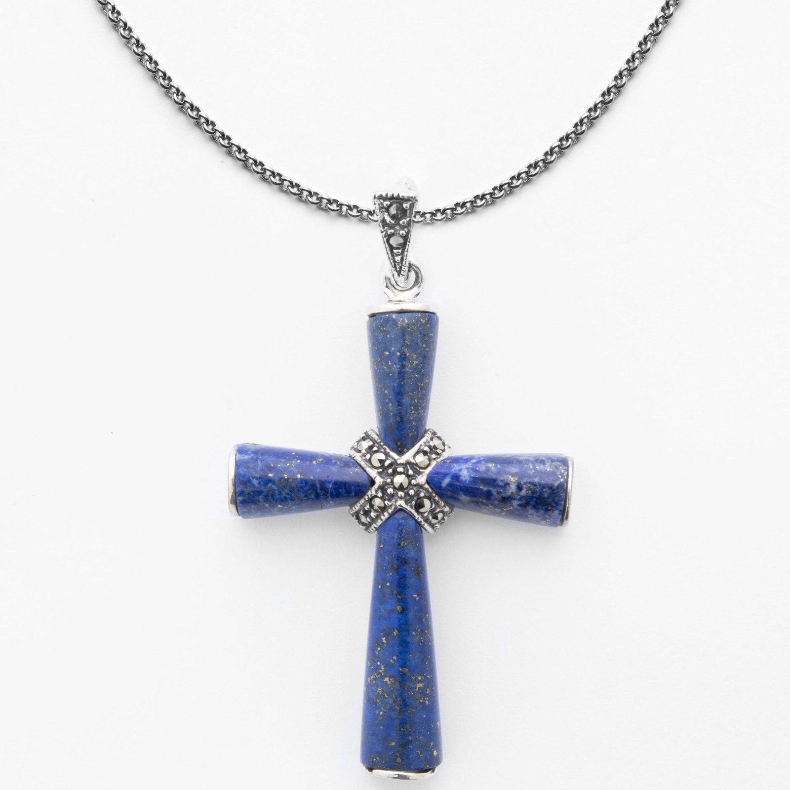 Sterling Silver Lapis & Marcasite Cross Pendant: • Genuine lapis & marcasite • Stones set in a cross shape • Measurement: 48mm L x 28mm W x 5mm H • 18 inch silver chain • Gleaming rhodium over fine sterling silver