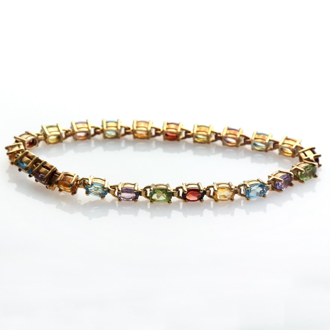 Silver Multi Gemstones Tennis Bracelet 7.5": • Genuine Amethyst/ Swiss Blue Topaz/ Citrine/ Mozambique Garnet/ Peridot • Slide insert clasp for secure fit • 7.5 inch length • 14K Gold over sterling silver