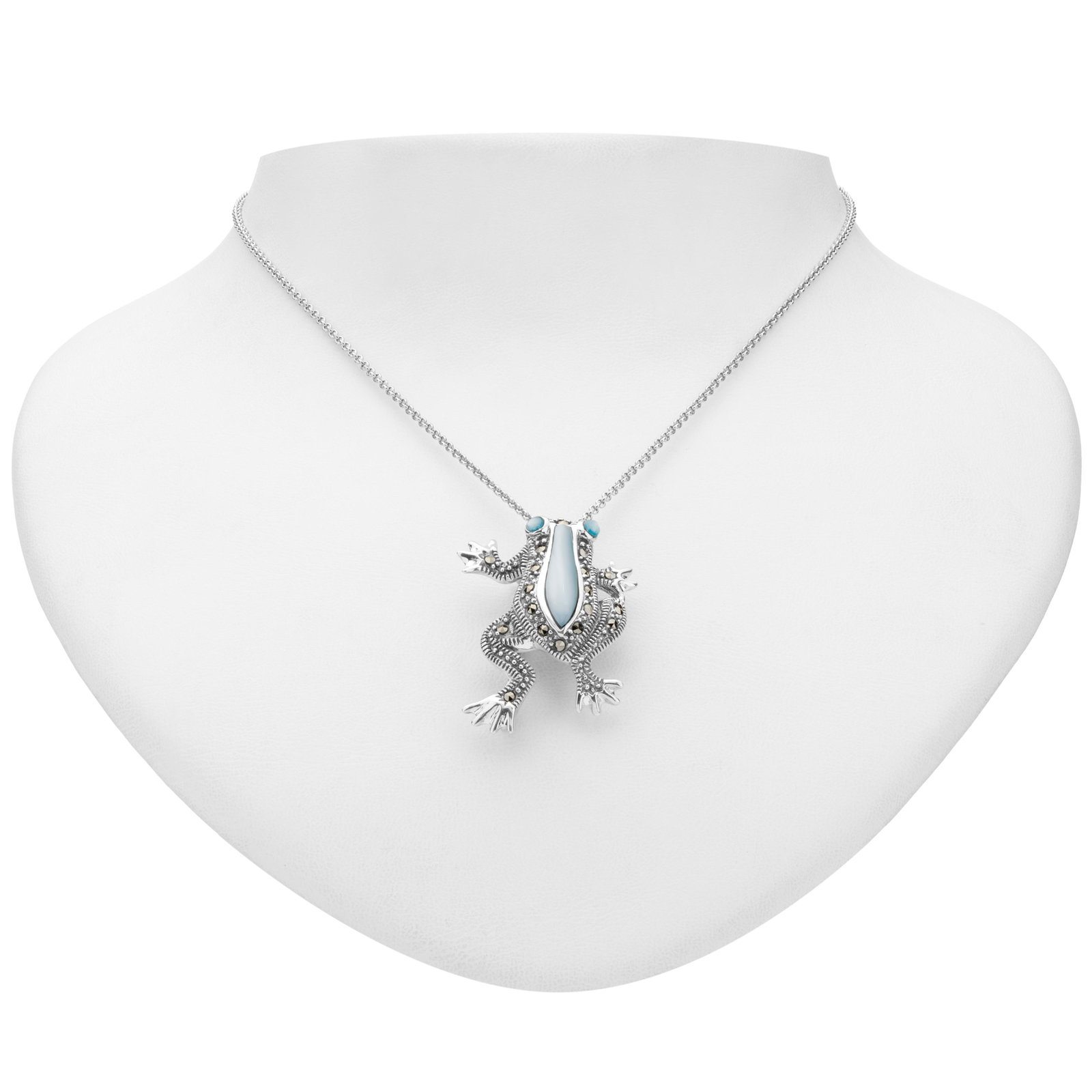 Sterling Silver Blue MOP & Marcasite Frog Pendant: Metal: Rhodium over sterling silver Stone Information: Turquoise: Blue Mother of pearl 18x5mm & 2.6mm and Marcasite round 1.5mm Setting Type: Bezel/Adhesive/ Prong Measurements: Pendant: 36mm L x26mm 
