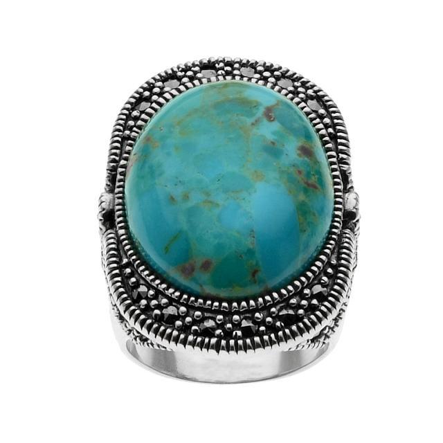 Sterling Silver Turquoise & Marcasite Ring-SZ 10: One genuine turquoise gemstone cabochon sits in a north-south orientation at the center surrounded by smoldering grey marcasites that spill over onto the contoured sides of the setting. Rope texture f