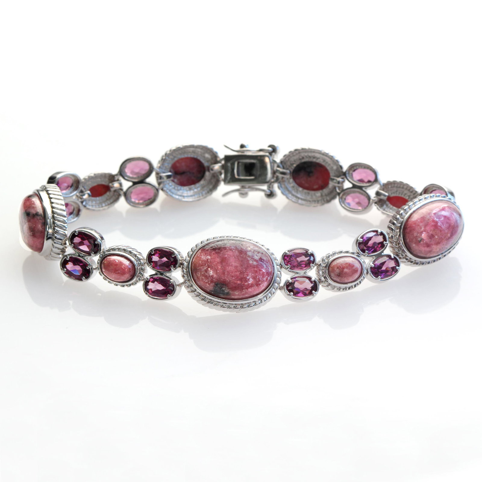 Sterling Silver Rhodonite & Garnet Bracelet 7.5": Pangea Mines Treasured Gems Collection Genuine sparkling rhodolite garnet & rhodonite gemstones adorn this lovely design from the Pangea Mines Treasured Gems Collection. Crafted in gleaming rhodium ov