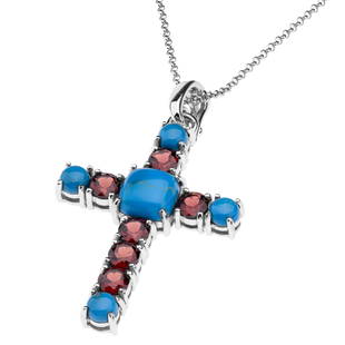 Sterling Silver Ceruleite & Garnet Cross Pendant: Beautiful rare cerulean blue ceruleite cabochons punctuate the center of the cross and the ends of the arms and post. Shimmering Mozambique Garnet gemstones adorn the spaces in between. A chain