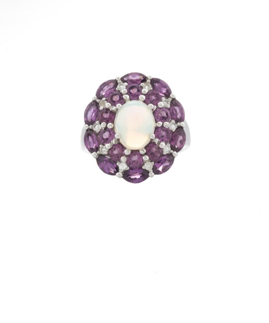 Silver Ethiopian Opal & Garnet Halo Ring-SZ 7: Make a statement and make it beautifully with this striking design from the Pangea Mines Treasured Gems Collection. Beautifully crafted in gleaming anti-tarnish rhodium over sterling silver and adorne