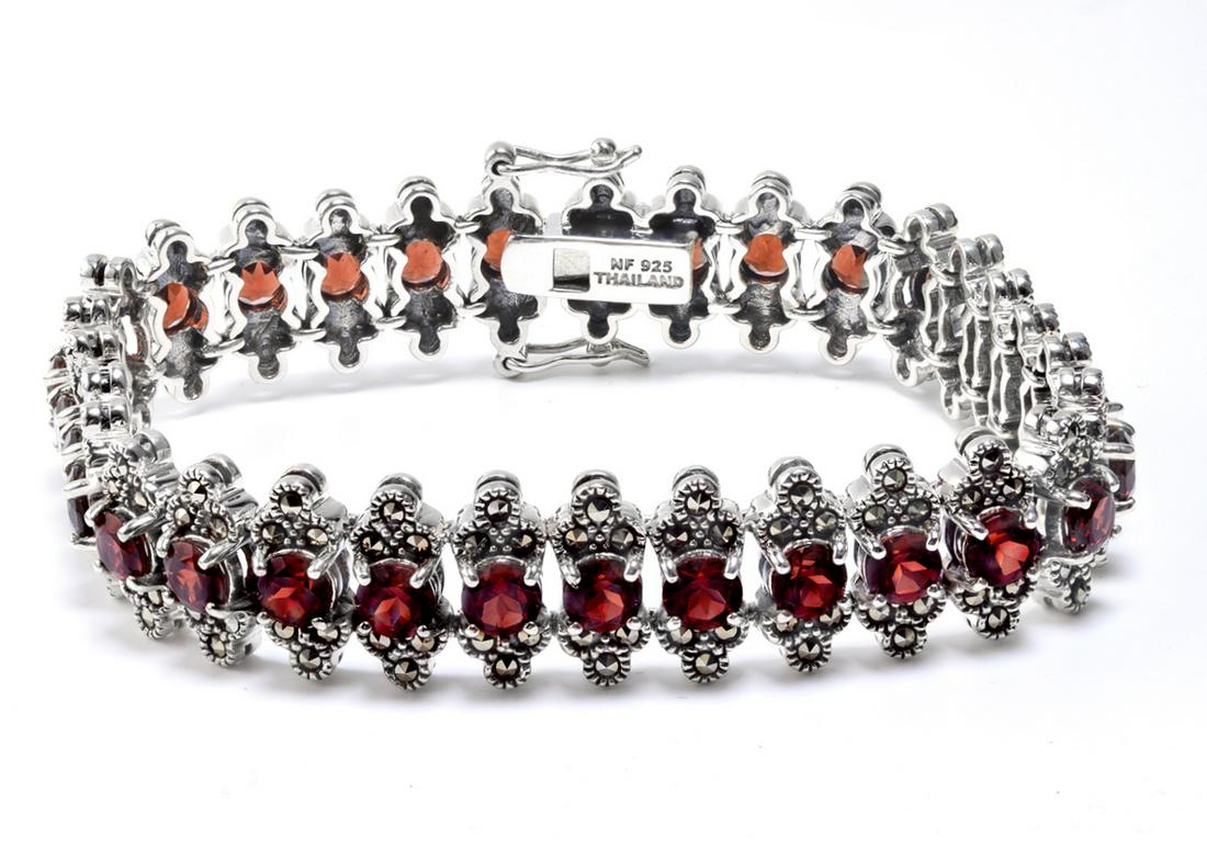 Silver Garnet & Marcasite Line Bracelet 7.5": This lovely slender bracelet from the Pangea Mines Treasured Gems Collection is beautifully crafted in fine sterling silver and adorned with sparkling genuine Mozambique garnet accented by marcasite. 