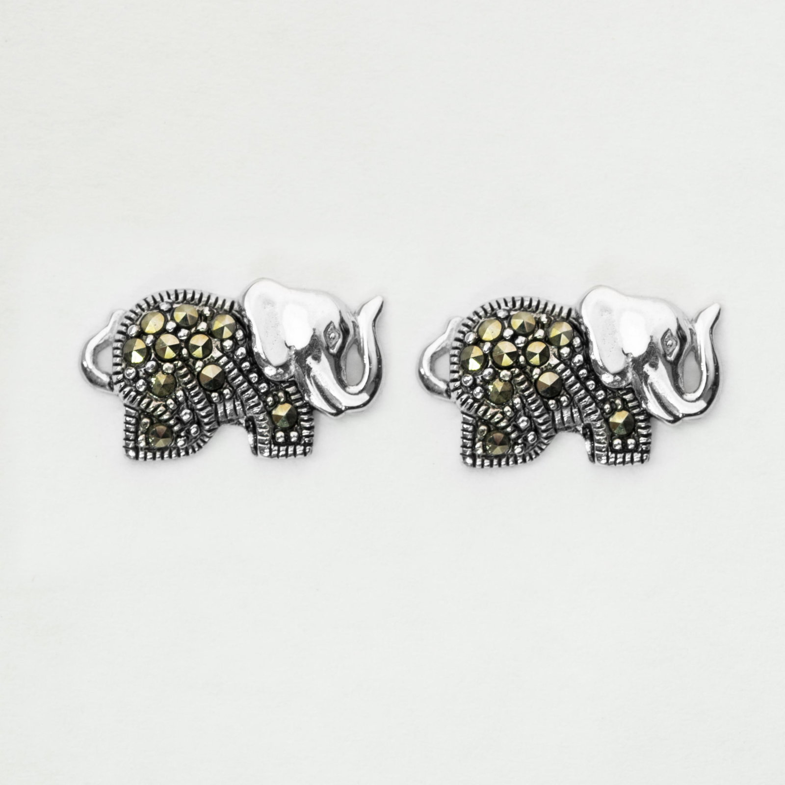 Sterling Silver Marcasite Elephant Stud Earrings: • Genuine marcasite • Measurement: 17mm L x 10mm W x 4mm H • Comfortable butterfly clasp • Gleaming rhodium over fine sterling silver