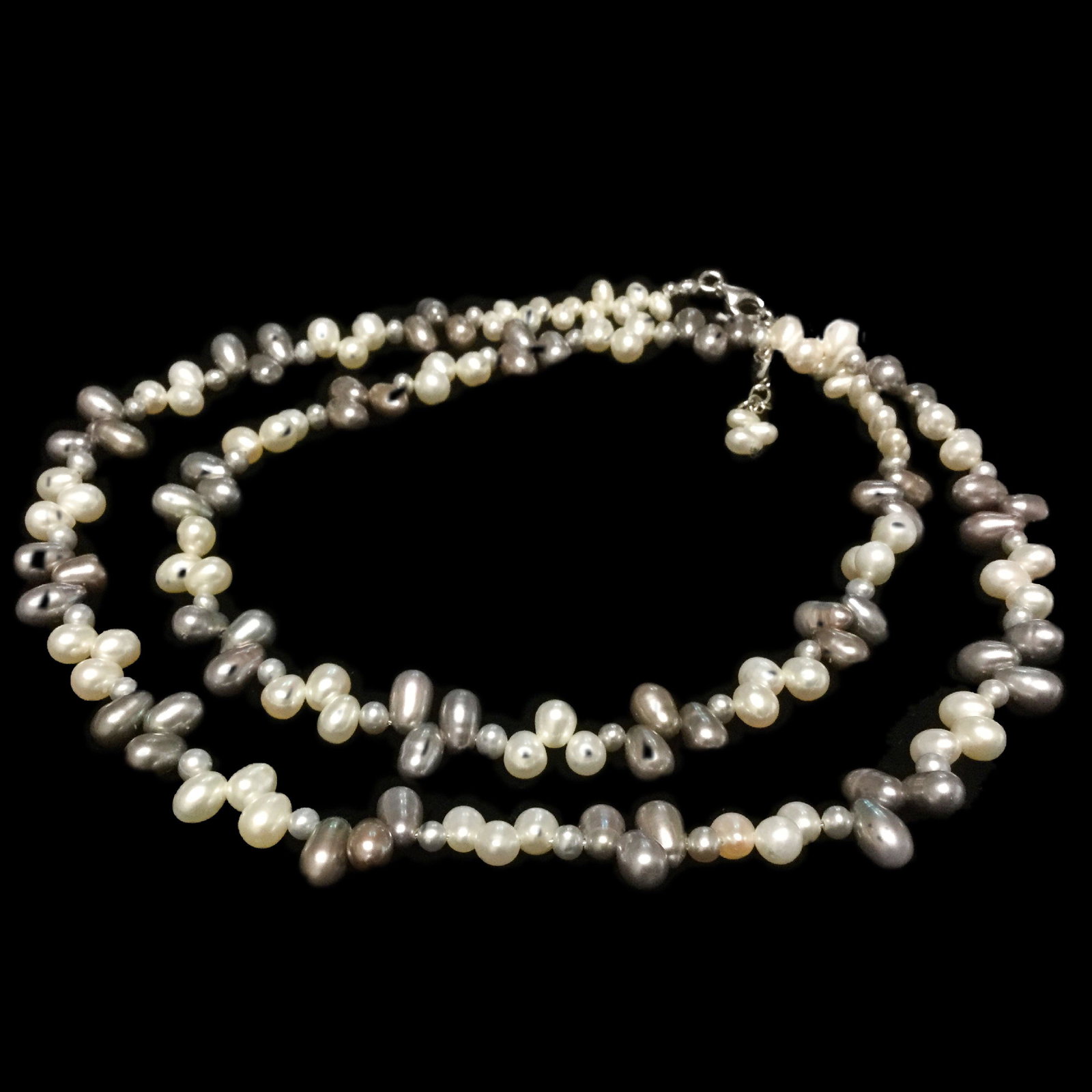 24 Inch Multi Colored Pearl Necklace: • Stone : Pearl • Design: Multi Colored Pearl • Length: 24 Inch • Secure Clasp • Disclaimer: Gemstones may feature inclusions or imperfections and the images are enhanced