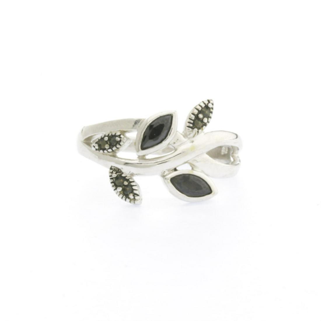 Black Cubic Zirconia With Marcasite Ring SZ 9: • Stone: Cubic Zirconia and Marcasite • Metal: Brass • Color: Black and Grey-Black • Size: 9 • Disclaimer: Gemstones may feature inclusions or imperfections and the image