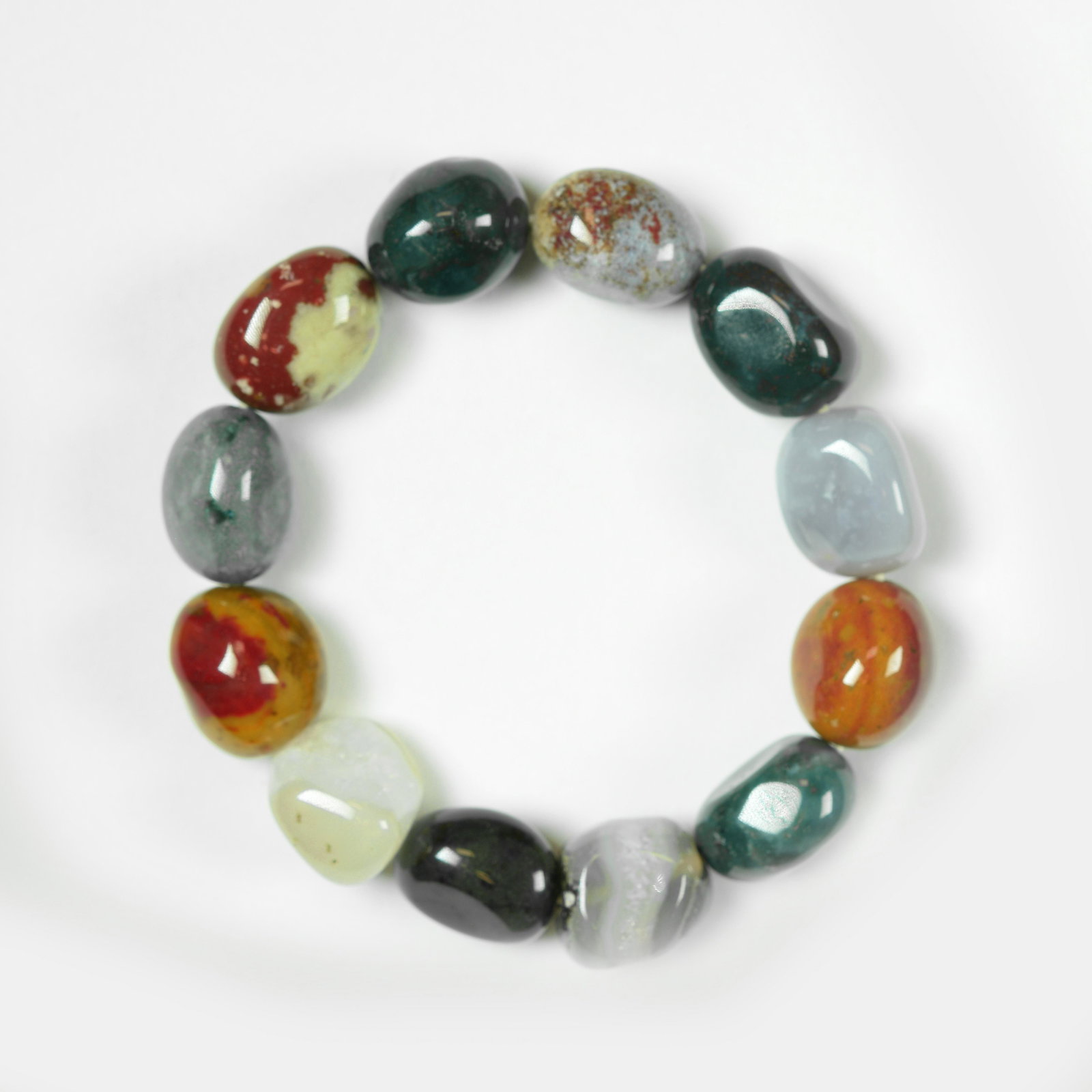 Genuine Multi Stone Bangle: • Genuine Stone Bangle • Multi Colored • Approx Length : 6 inches• Disclaimer: Gemstones may feature inclusions or imperfections and the images are enhanced.