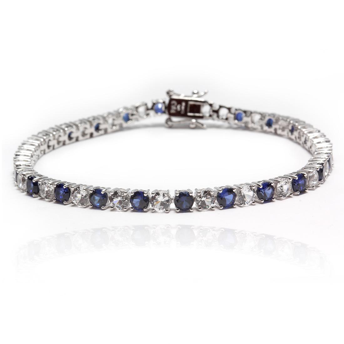 Sterling Silver Blue & White Tennis Bracelet 8": • Color: Blue & White • Measurements: 8"• Tennis Bracelet • Gleaming rhodium over fine sterling silver• Disclaimer: Gemstones may feature inclusions or imperfections and 