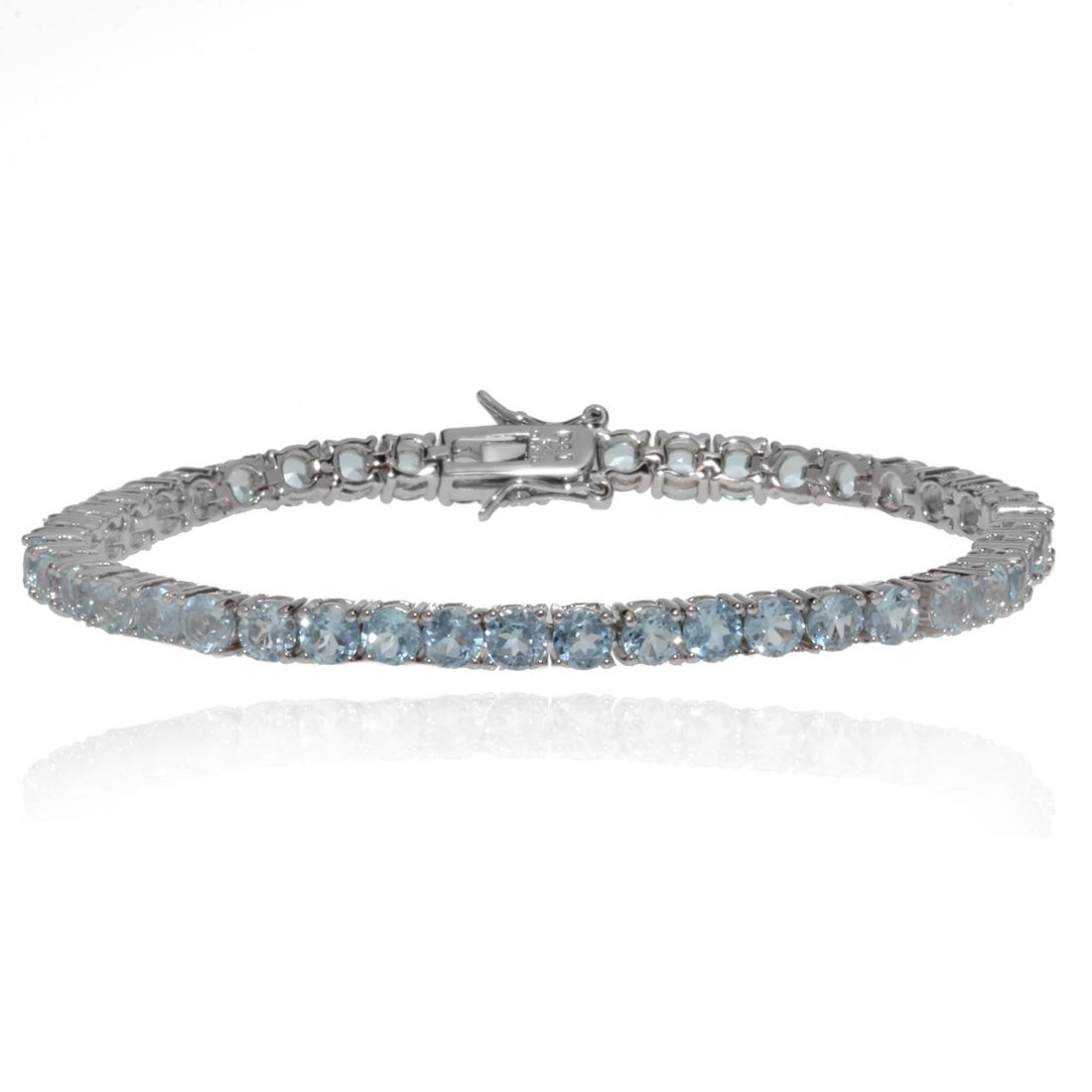 Sterling Silver Blue Topaz Tennis Bracelet: Sterling Silver Blue Topaz Tennis Bracelet • Metal: Sterling Silver• Stone: Blue Topaz• Total Weight: 14.4 grams• Finish: Rhodium• Length:7.25 inches