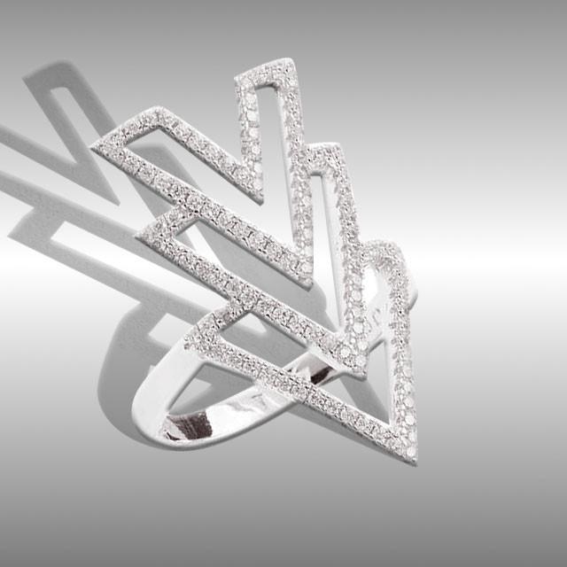 Sterling Silver Arrow Midi Thumb Ring-Size 7: • Sparkling cubic zirconia• Setting: Prong/ Adhesive• Measurement: 27mm L x 20mm W • Gleaming rhodium over fine sterling silver• Disclaimer: Gemstones may feature inclusi