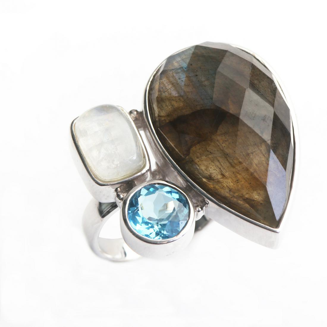 Sterling Silver Labradorite & Gemstones Ring-SZ 7: What an interesting design! Pangea Mines designers have crafted a unique look for you. Genuine labradorite, rainbow moonstone and Swiss blue topaz adorn a gleaming rhodium on sterling silver setting t