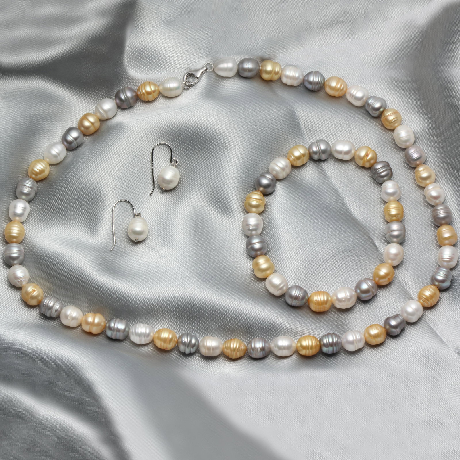 Set Of Multi Color Freshwater Pearl: Sterling Silver Multi Colored Freshwater Pearl Necklace,Bracelet&Earring • Metal: Sterling Silver• Stone:Multi Color Freshwater Pearl • Total Weight:62.8 grams• Clasp: Lobster&