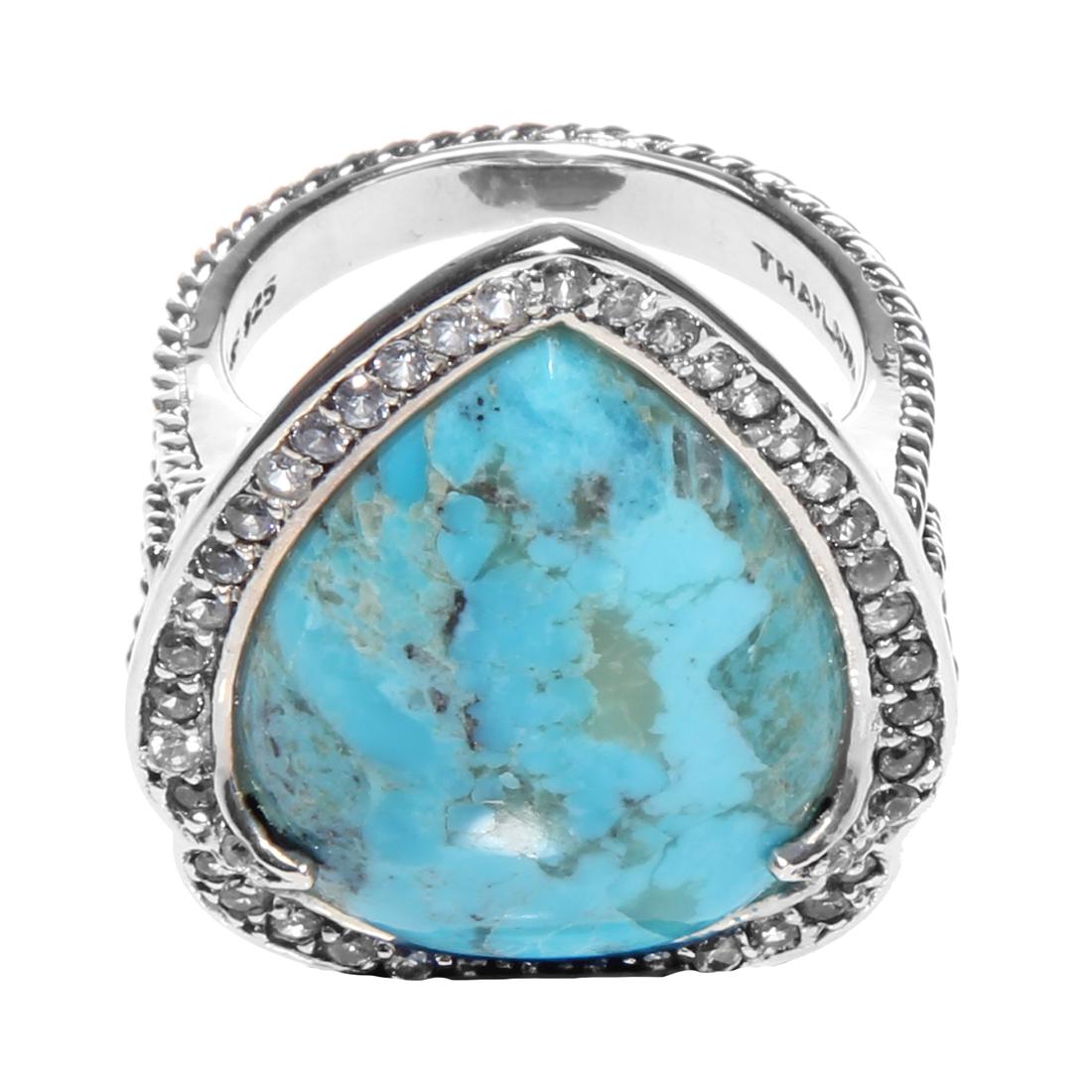 Silver Turquoise & White Zircon Halo Ring-SZ 6: Metal: Sterling SilverStone Information:Gemstone Choice: One pear shaped 23 x 17mm compressed and stabilized Kingman turquoise cabochonWhite Zircon: Various round modified-brilliant cut 1.2-1.5mmSetti