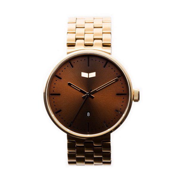 Vestal Roosevelt Metal Watch - Gold/Brown: The Roosevelt is a signature Vestal timepiece with its clean slim line case and straightforward dial. The premium 3 hand Japanese analog movement with date rests inside a multi-layered 42mm 316L solid