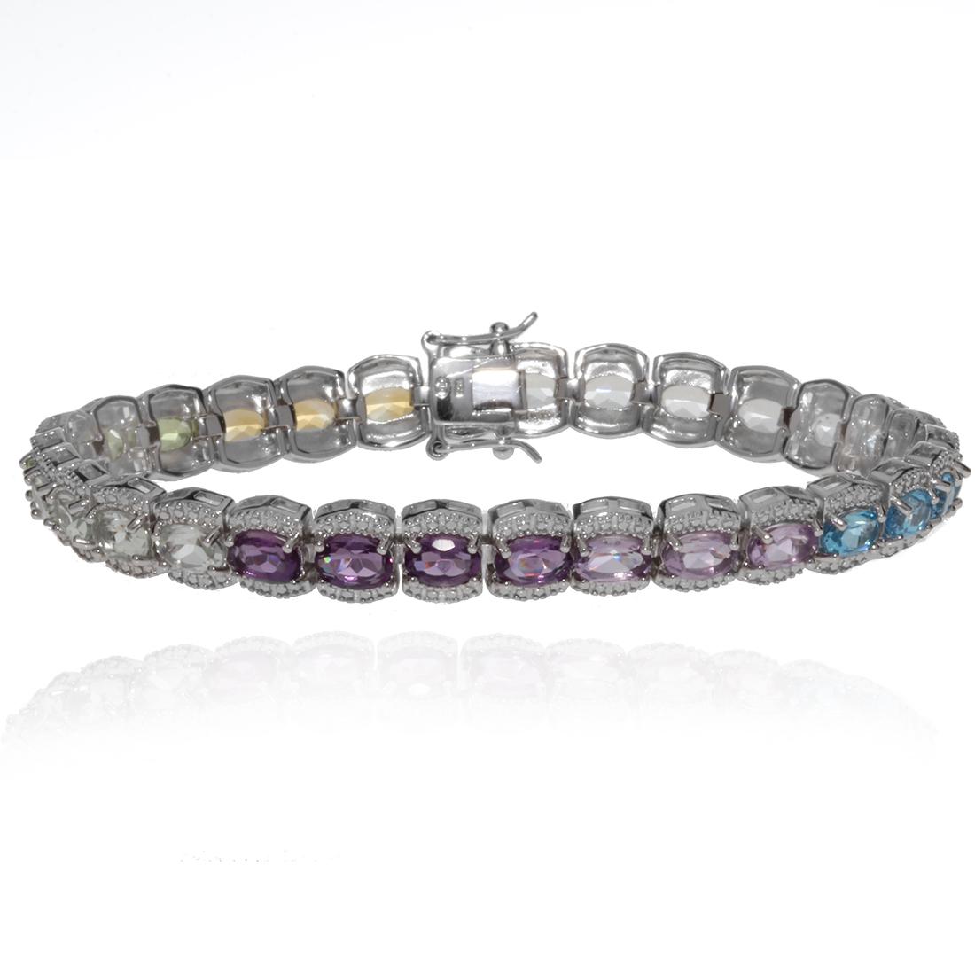Sterling Silver Multi Gemstone Bracelet: Sterling Silver Multi Gemstone Bracelet • Metal: Sterling Silver• Stone: Amthethyst,Blue Topaz,Citrine,Peridot• Total Weight: 19.6 grams• Finish: Rhodium• Length: 7 3/4 i