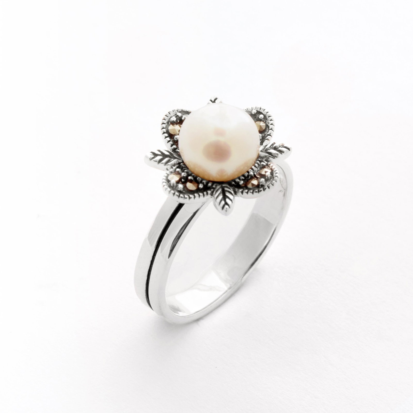 Silver Freshwater Pearl & Marcasite Ring-SZ 8: • Genuine 8mm round cut freshwater pearl and marcasite• Setting: Prong/ Bezel/ Adhesive• Measurement: 13mm L x 22mm W x 8mm H • Gleaming rhodium over fine sterling silver•