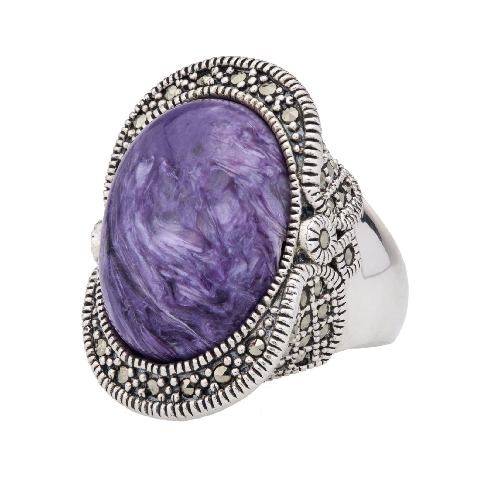 Sterling Silver Charoite & Marcasite Ring-SZ 6: One swirling purple Chariote gemstone cabochon sits in a north-south orientation at the center surrounded by smoldering grey marcasites that spill over onto the contoured sides of the setting. Rope te