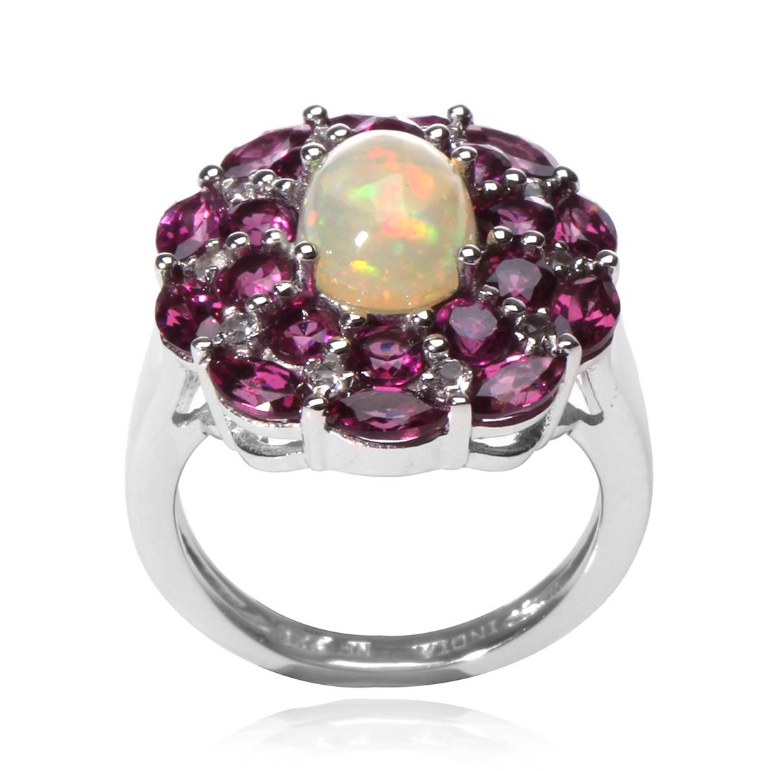Silver Ethiopian Opal & Garnet Halo Ring-SZ 9: Make a statement and make it beautifully with this striking design from the Pangea Mines Treasured Gems Collection. Beautifully crafted in gleaming anti-tarnish rhodium over sterling silver and adorne