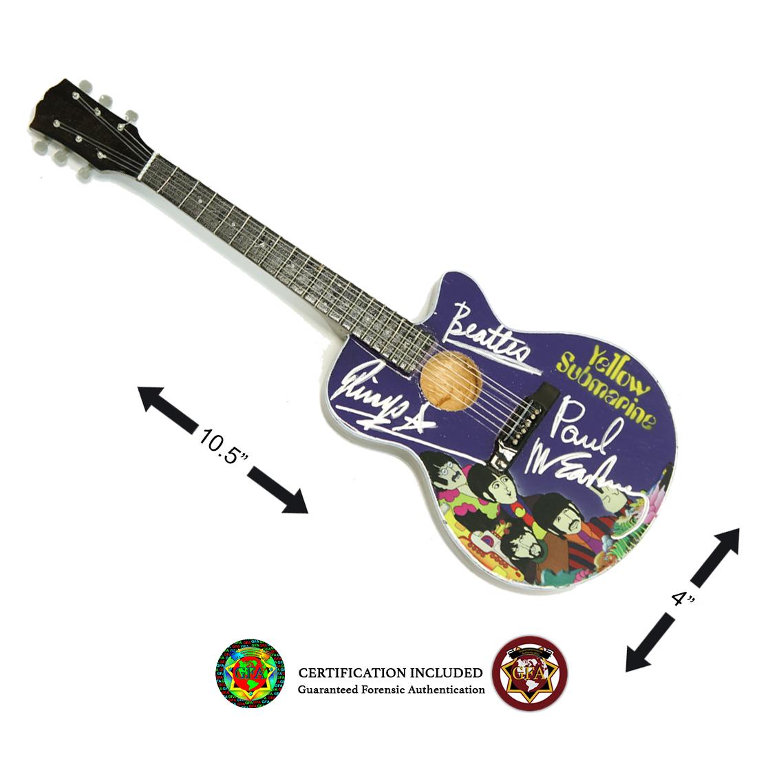 Paul McCartney and Ringo Starr Signed Mini-Guitar: Paul McCartney was born on June 18, 1942 and Ringo Starr was born on July 7, 1940. Paul McCartney and Ringo Starr signed Yellow Submarine mini guitar. Both boldy signed in Silver Felt-tip on the body